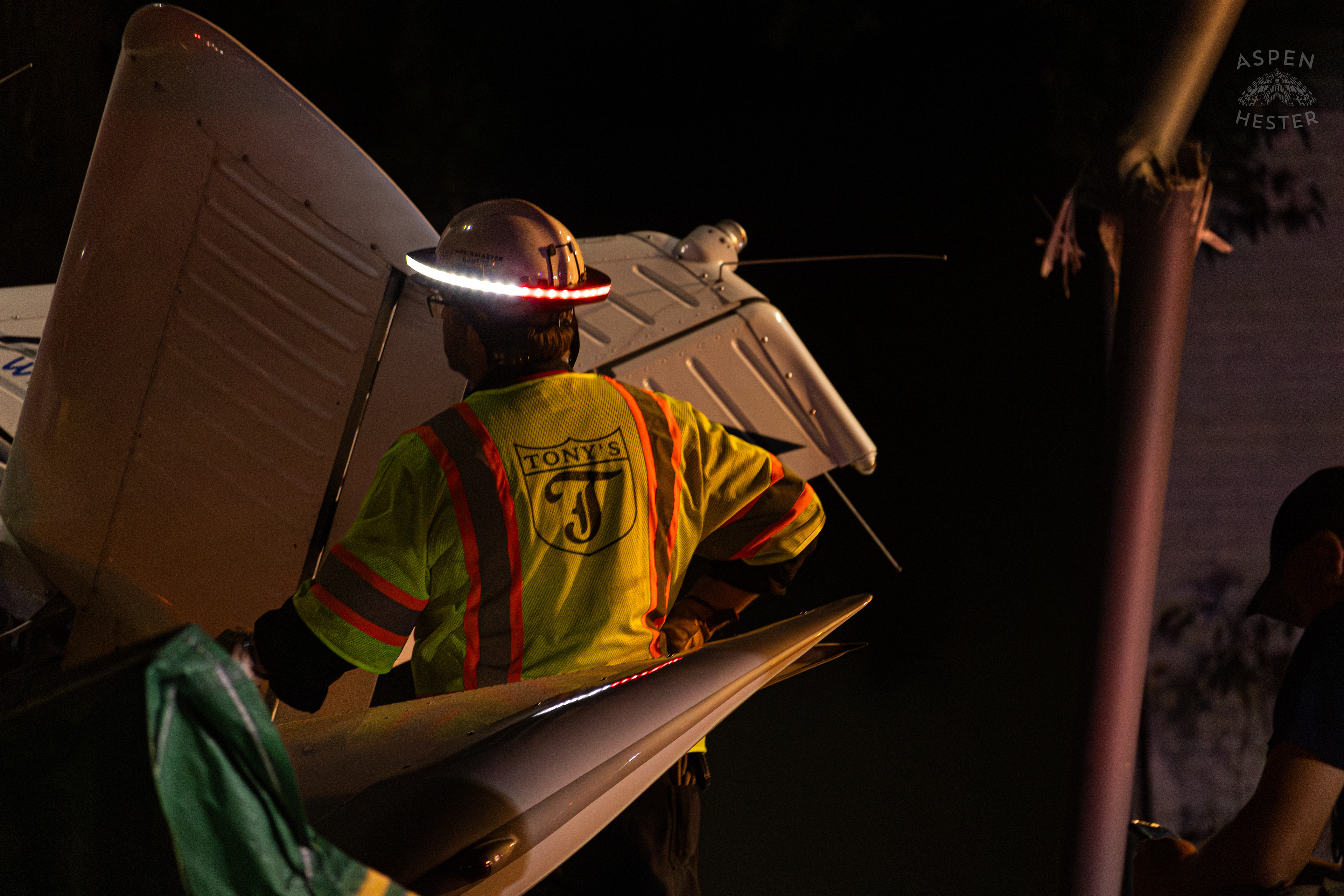 Tony’s Wreckers Crew Working to Remove The Piper Cherokee Plane from the Road after it Crash Landed, Taking Out Utility Poles, and Hitting A Car on Breckenridge Lane and Kresge Way. October 11th, 2024/Aspen Hester 