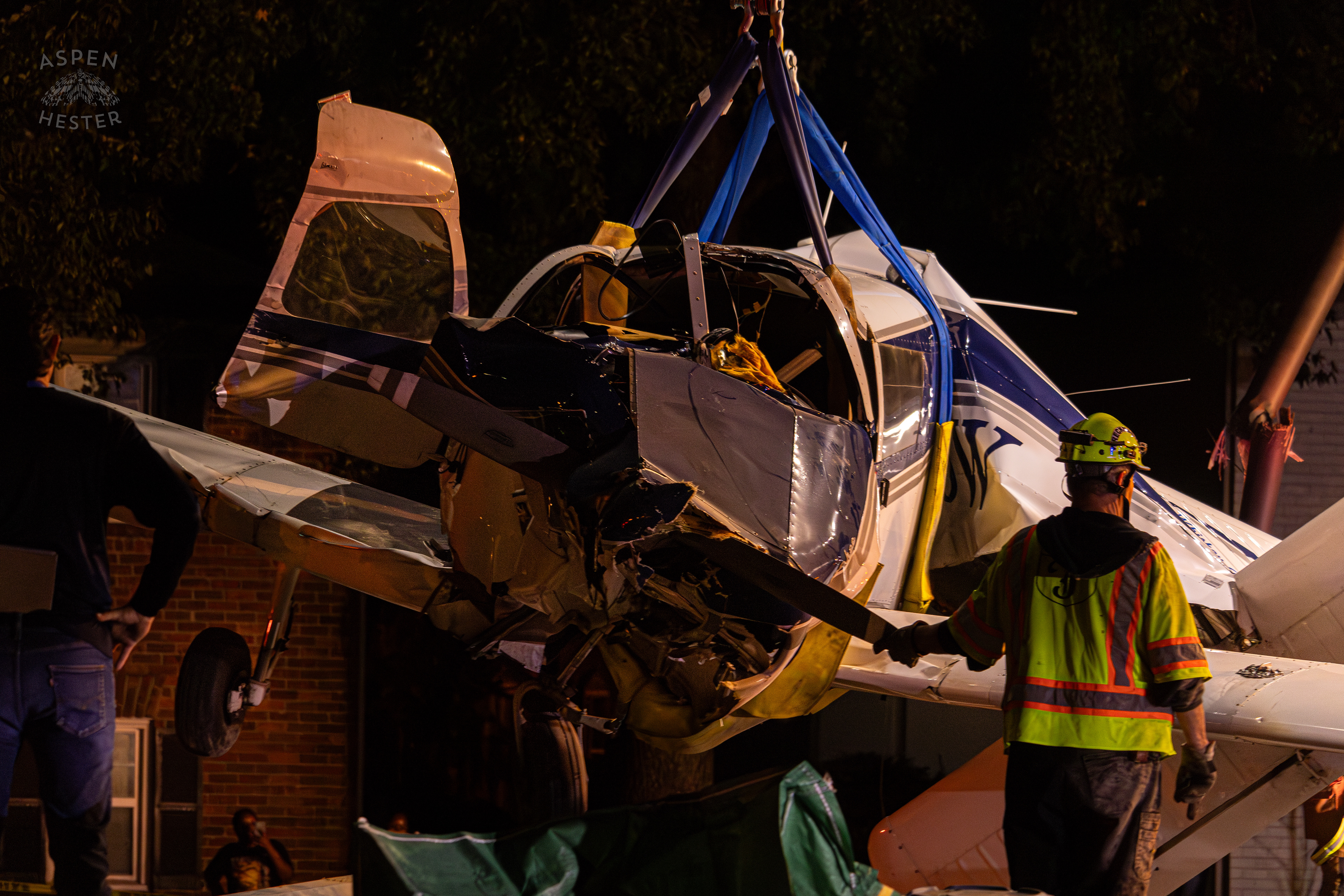 Tony’s Wreckers Crew Working to Remove The Piper Cherokee Plane from the Road after it Crash Landed, Taking Out Utility Poles, and Hitting A Car on Breckenridge Lane and Kresge Way. October 11th, 2024/Aspen Hester 