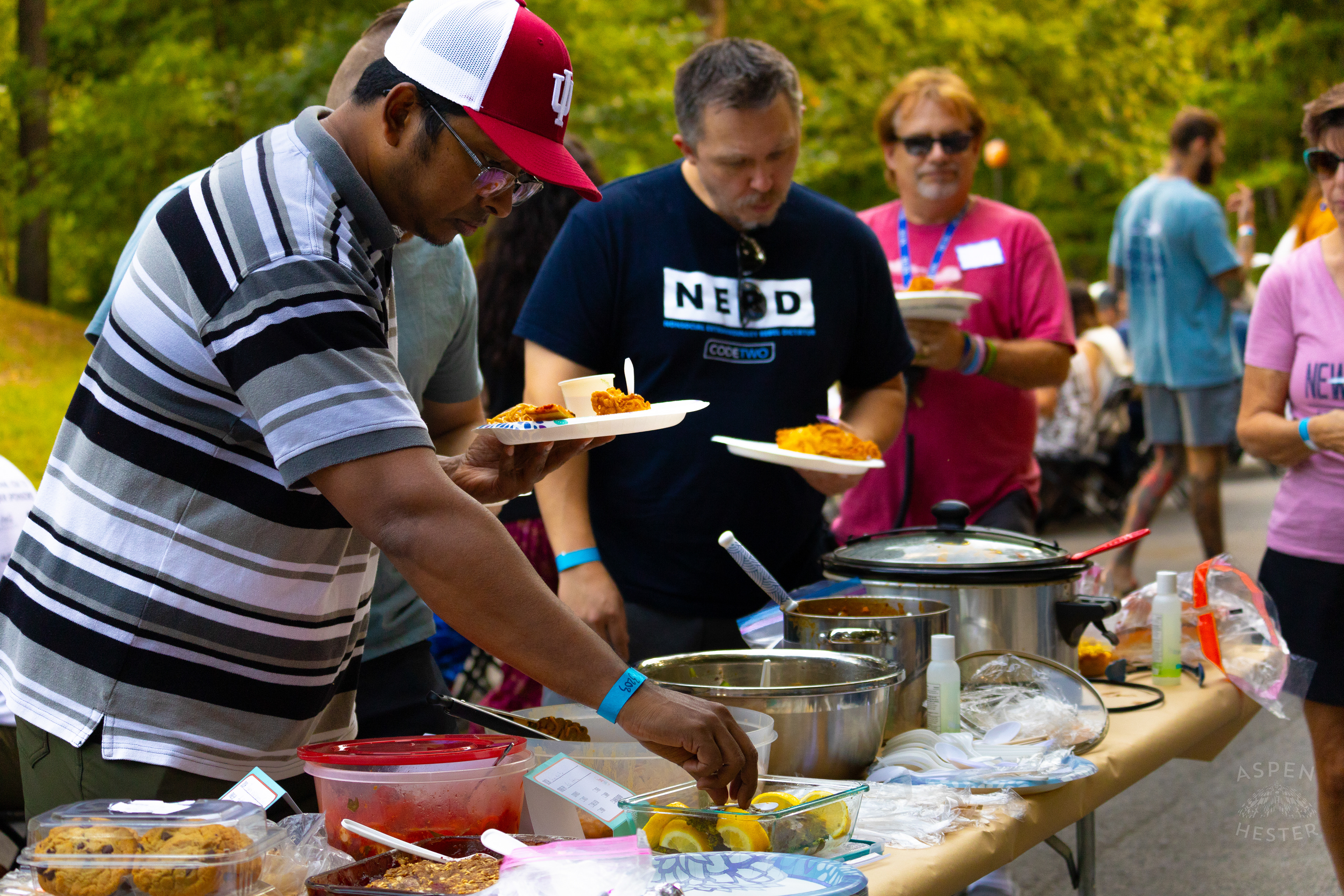 Community Members Filling Their Plates from The Big Table at Iroquois Park. September 15th, 2024/Aspen Hester