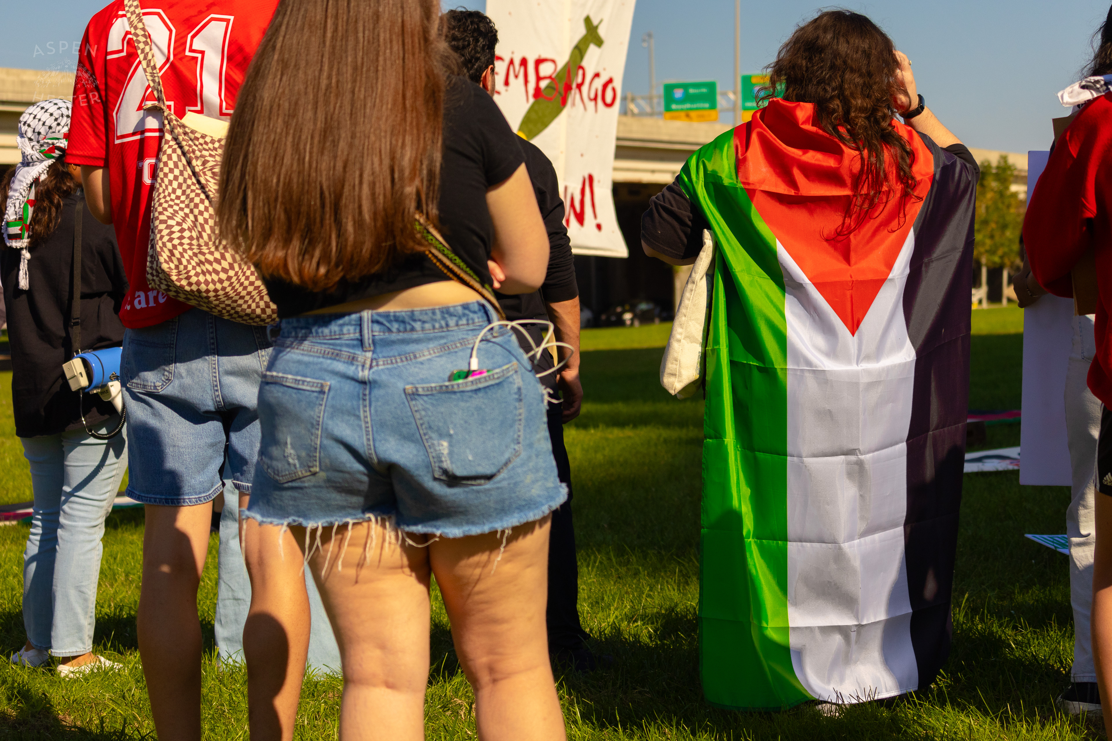 Protester Proudly Wears A Palestinian Flag During Louisville's One Year of Gaza Genocide Rally. October 5th, 2024/Aspen Hester 