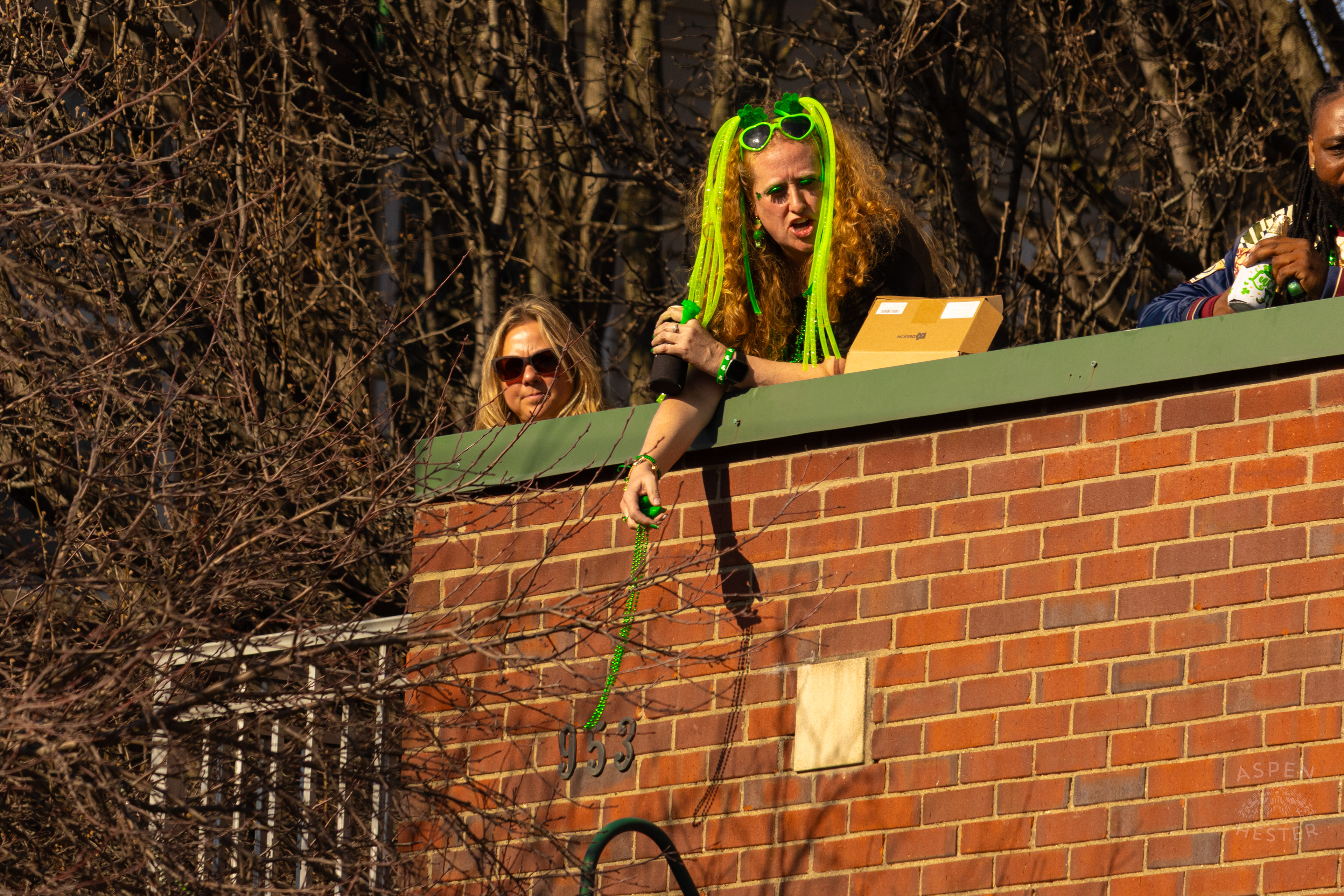 Spectators Watch The Festivities From Above as The 52nd Annual Saint Patrick’s Day Parade Rolls Through The Highlands. March 8th, 2025/Aspen Hester