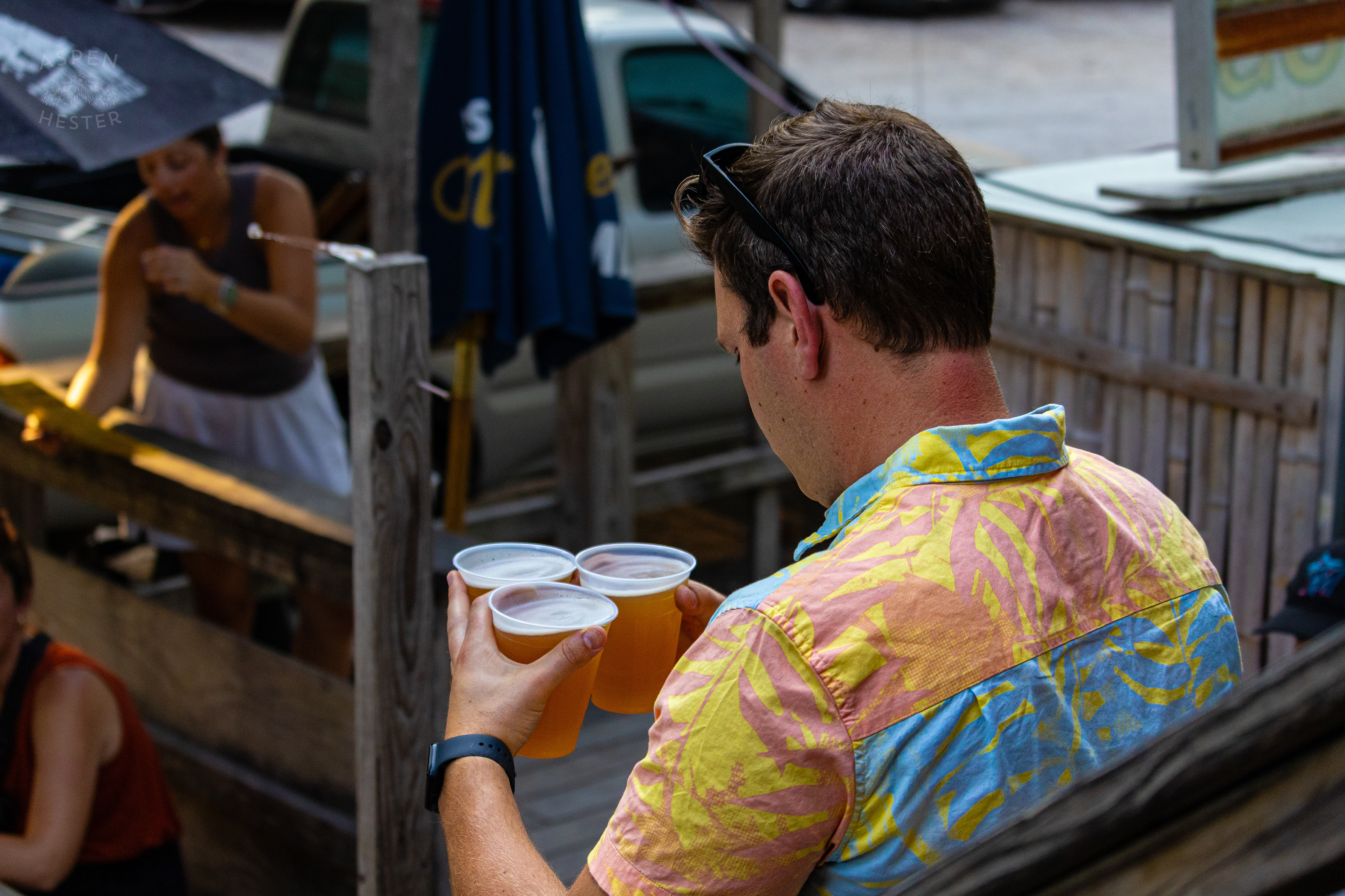 Taking Beers to A Table at Huc-A-Poos Bites and Booze on Tybee Island Georgia. June 25th, 2024/Aspen Hester