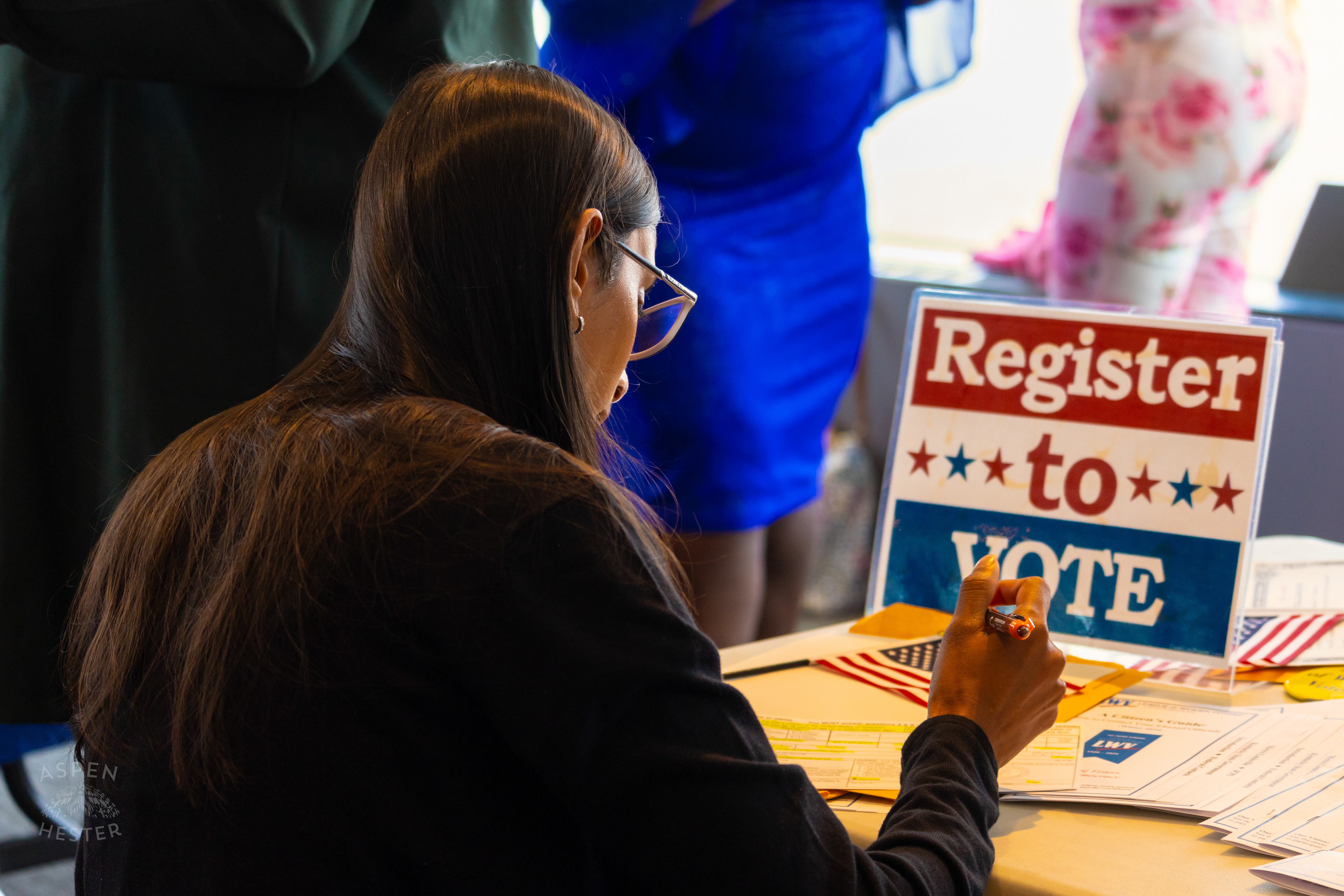 New American Citizen Registering to Vote After WorldFest's Naturalization Ceremony. August 30th, 2024/Aspen Hester