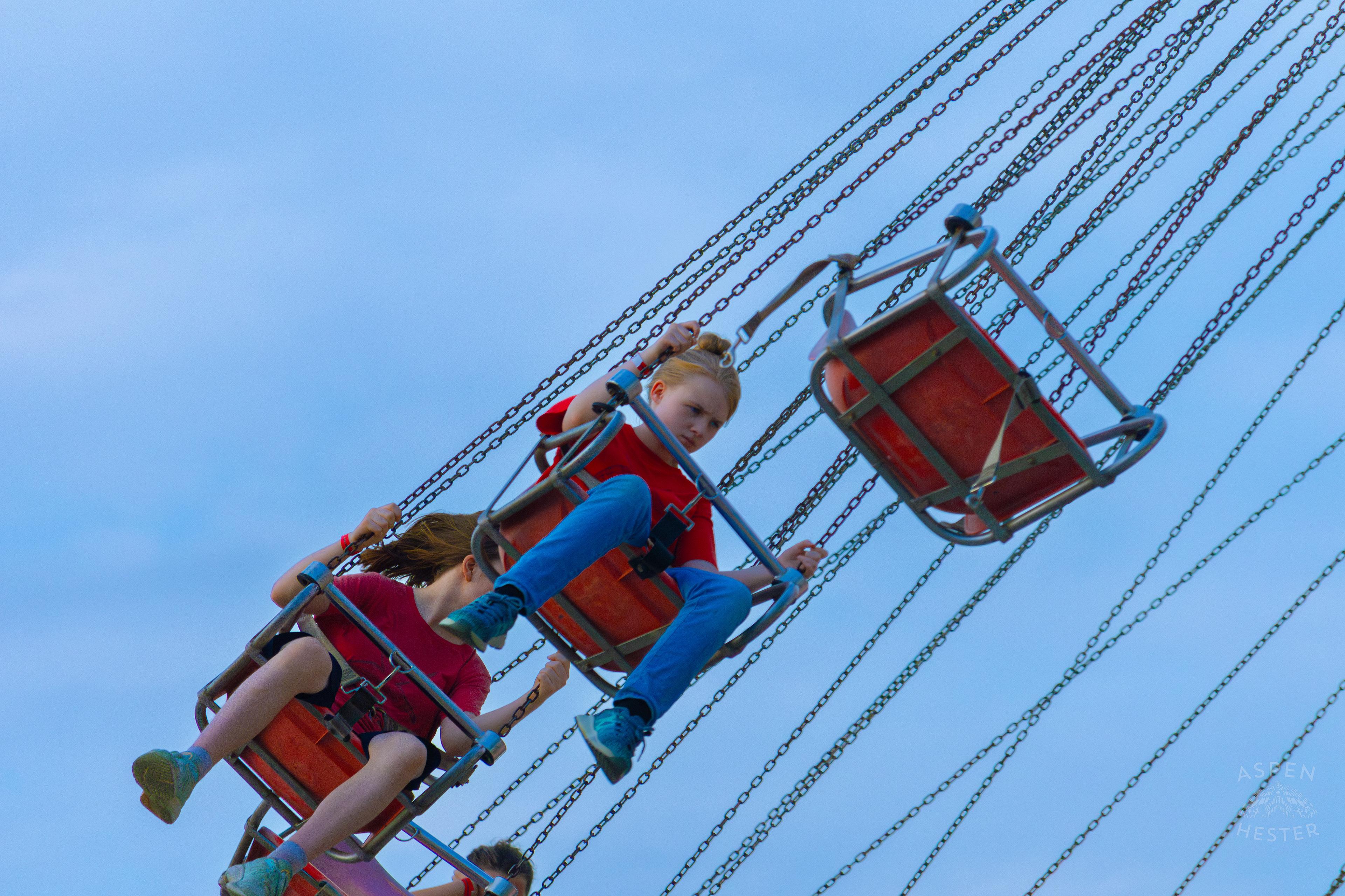 Very Unimpressed Kids Ride The Swings at The 120th Kentucky State Fair. July 15th, 2024/Aspen Hester