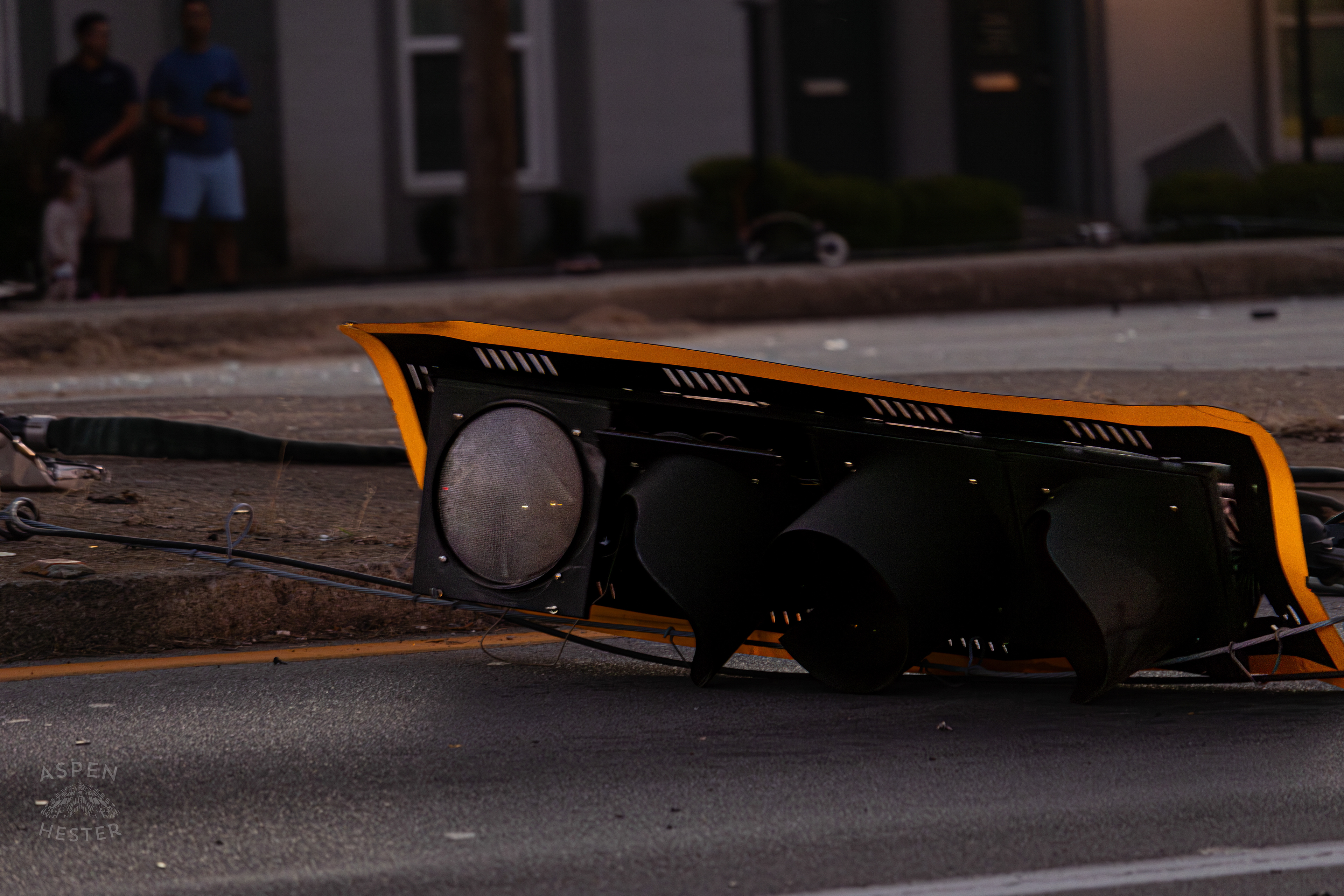 A Stoplight Lays in The Road after A Piper Cherokee Plane Crash Landed, Taking Out Utility Poles, and Hitting A Car on Breckenridge Lane and Kresge Way. October 11th, 2024/Aspen Hester 