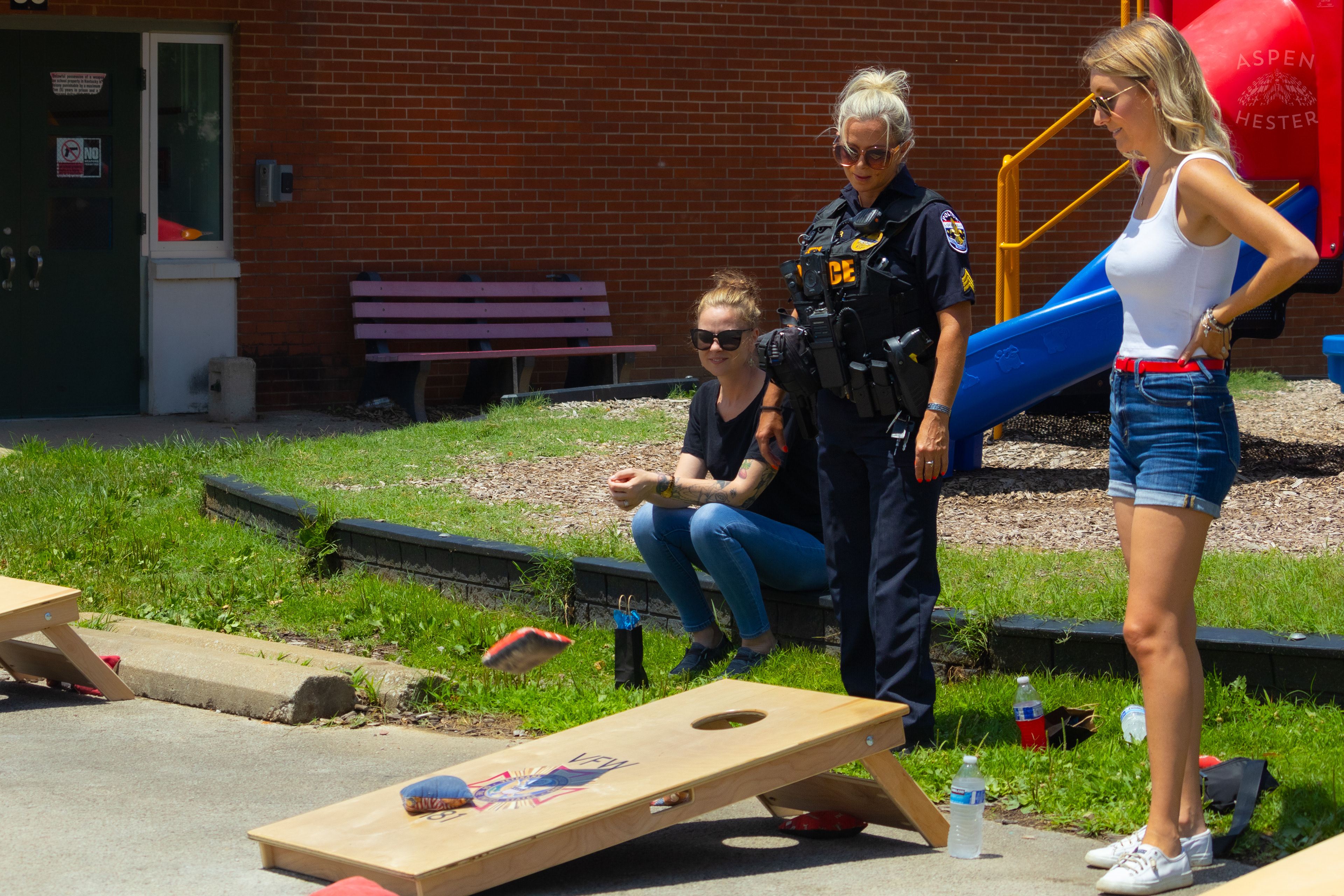 LMPD Officer Carmine Zoeller Participates in "Cornhole with Cops" Event. July 6th, 2024/Aspen Hester