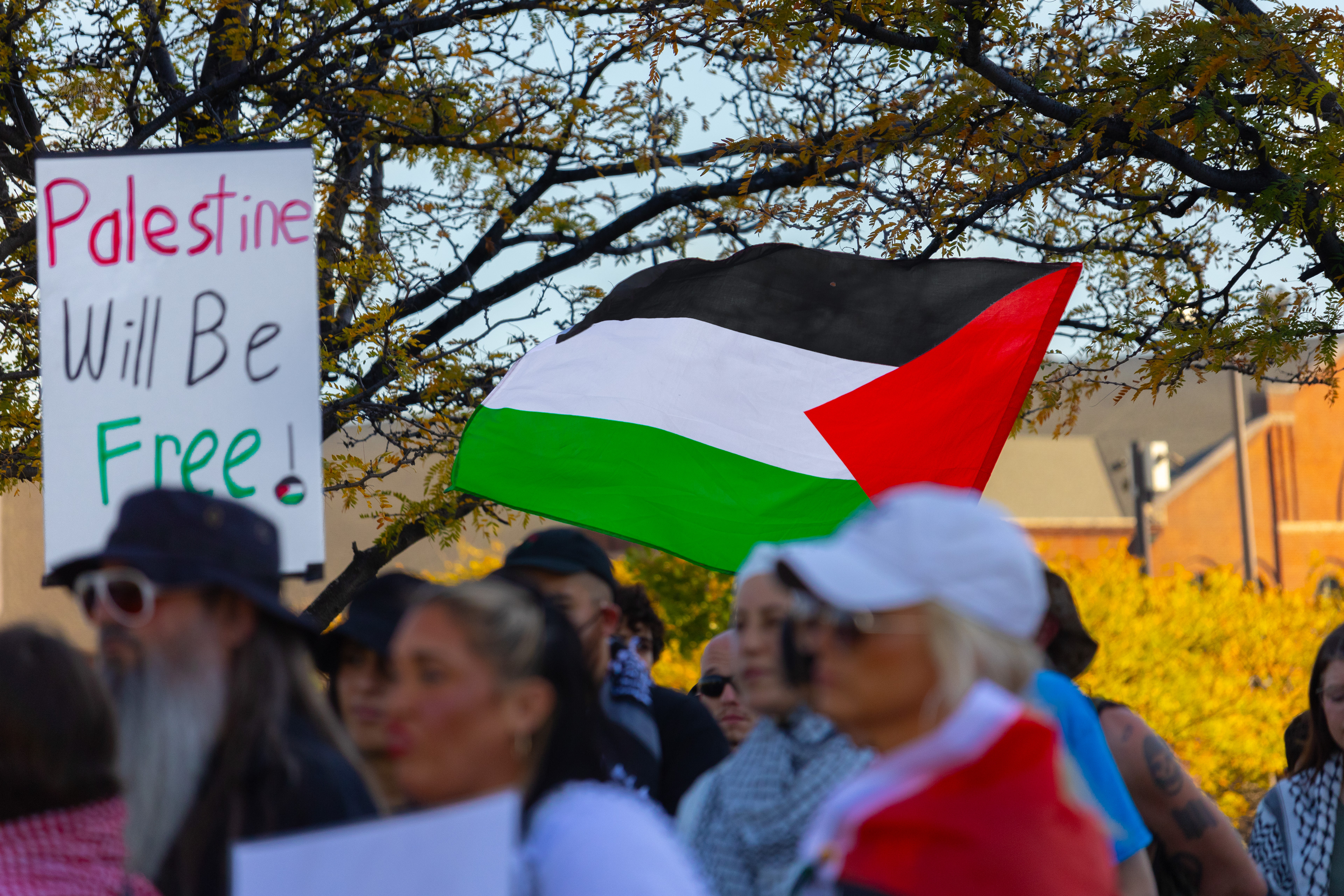 Palestinian Flag Flies and Protesters Insist “Palestine Will be Free” During Lousiville’s One Year of Gaza Genocide Rally. October 5th, 2024/Aspen Hester 