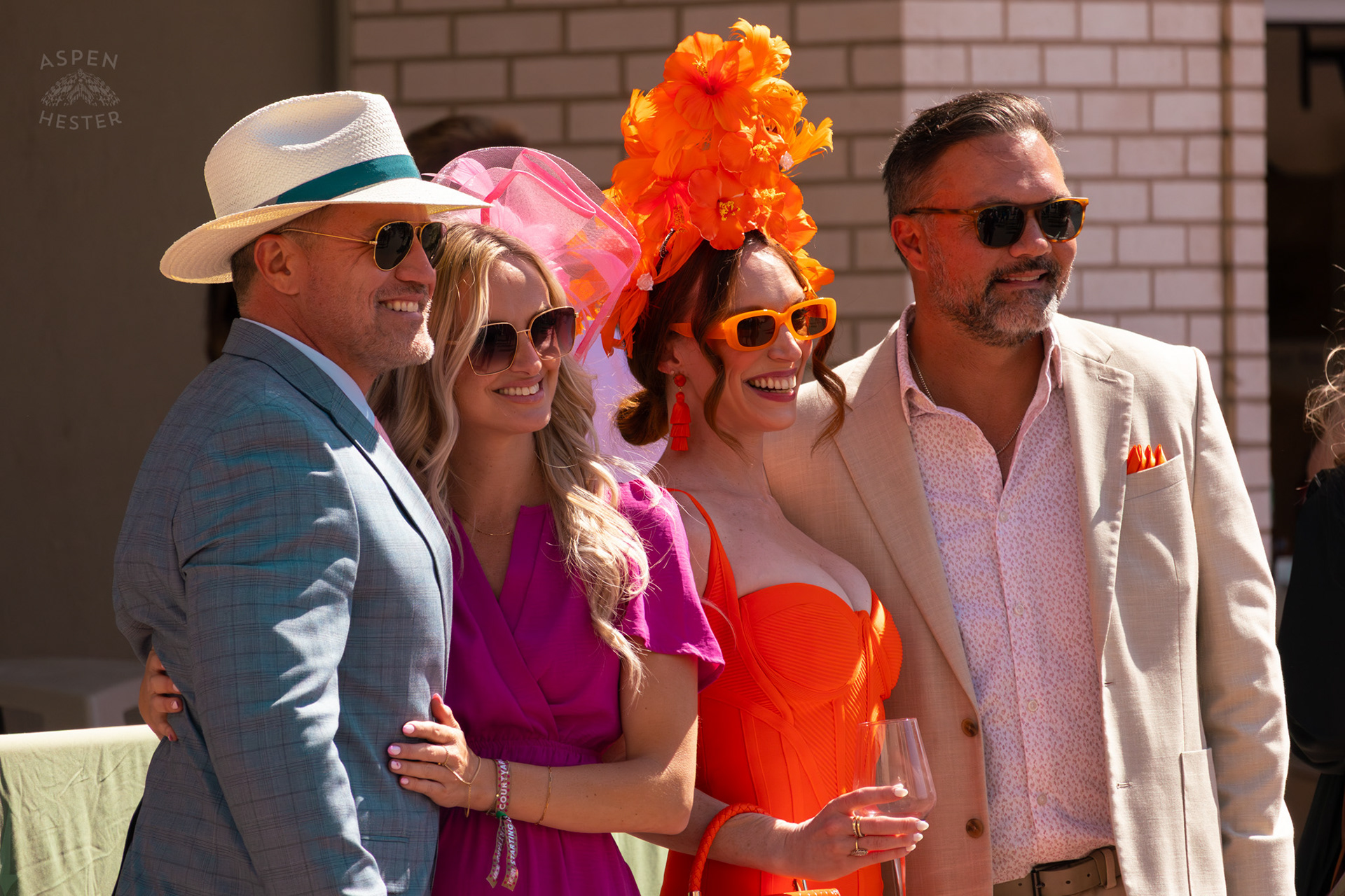 A Group of 4 Pose for A Photo Near The Churchill Downs Grand Stands During Thurby. April 30th, 2026/Aspen Hester
