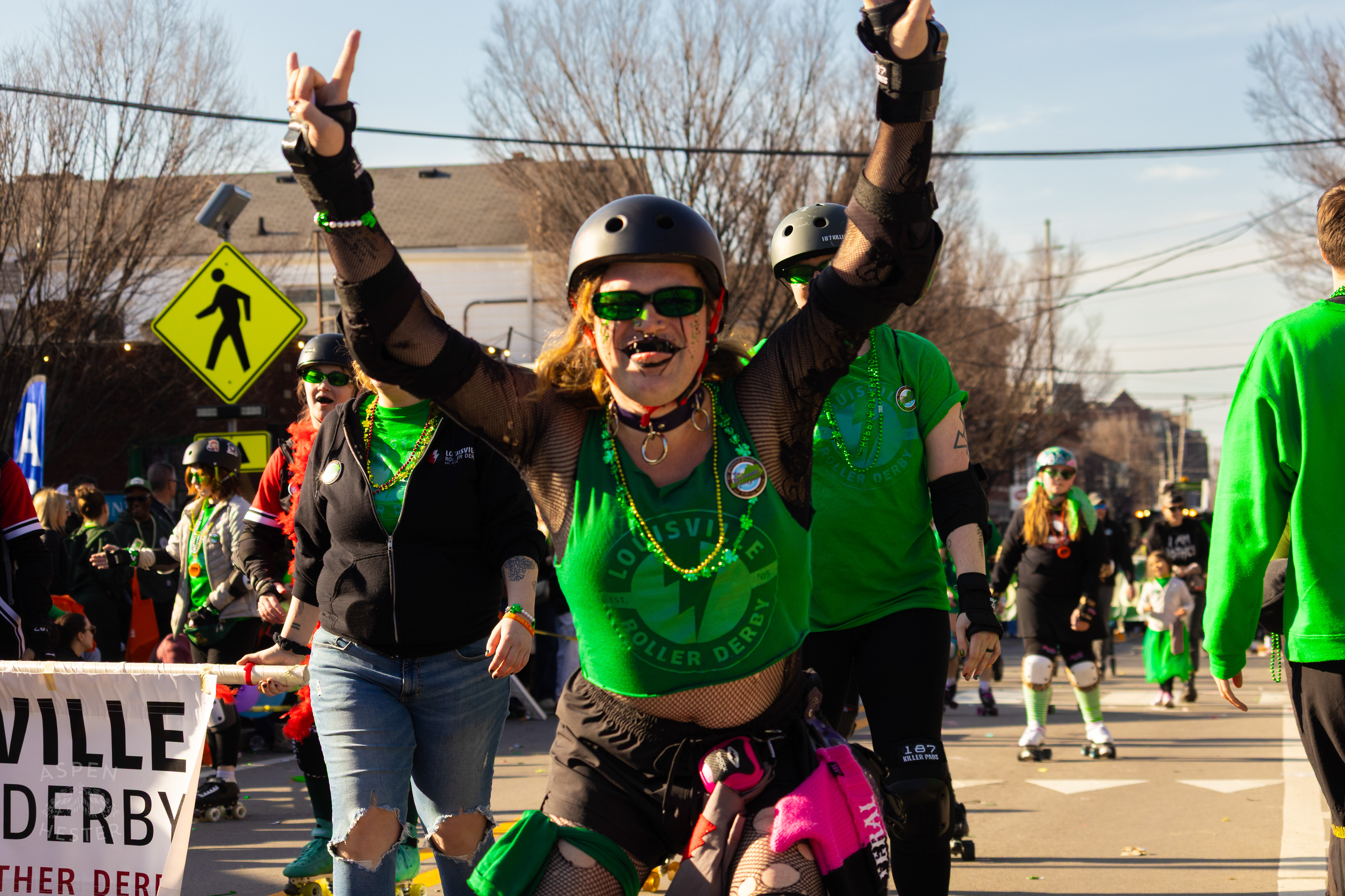 Members of Louisville Roller Derby Skate Through The Highlands in The 52nd Annual Saint Patrick’s Day Parade. March 8th, 2025/Aspen Hester