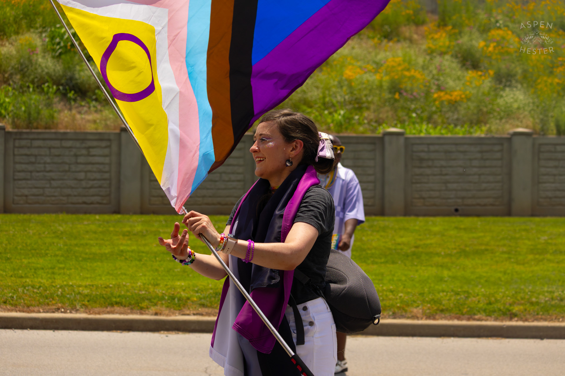 WHAS-11’s Ariel Lyles Twirls A Pride Flag Down River Road During The Annual Parade at Kentuckiana Pride 2025. June 21th, 2025/Aspen Hester 