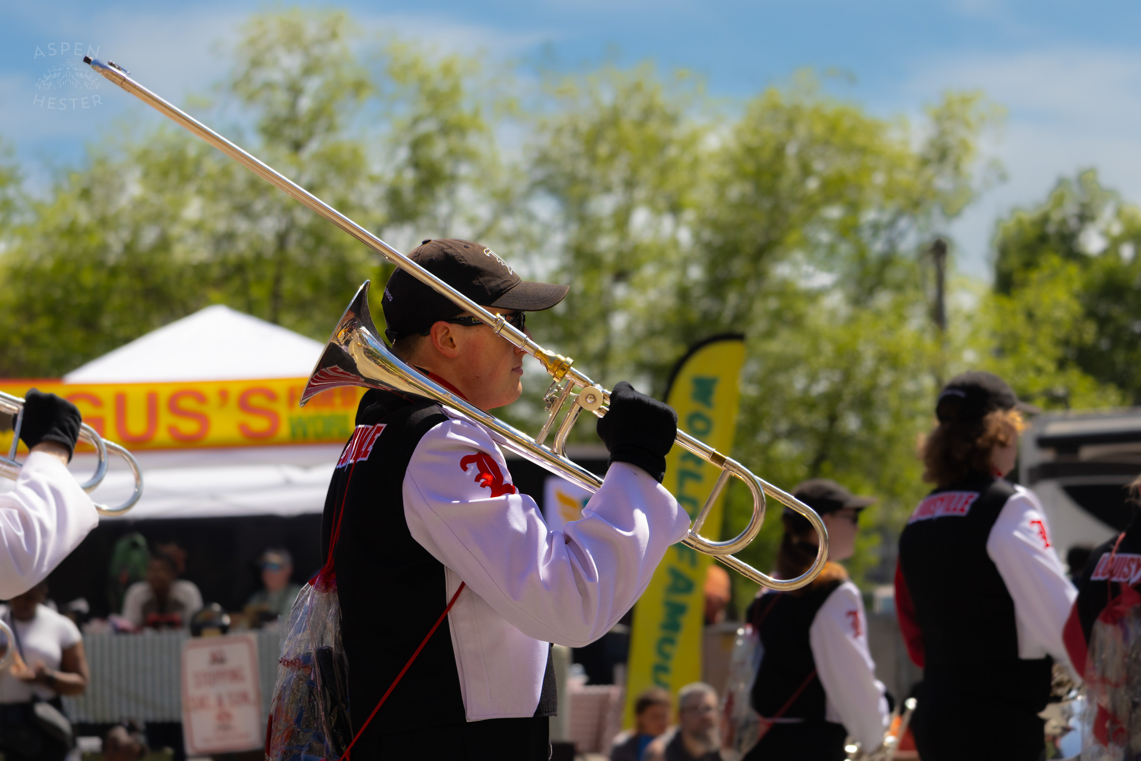 A Trombone Player in The University of Louisville Marching Band Walks Down West Broadway for The 70th Annual Pegasus Parade. April 27th, 2025/Aspen Hester