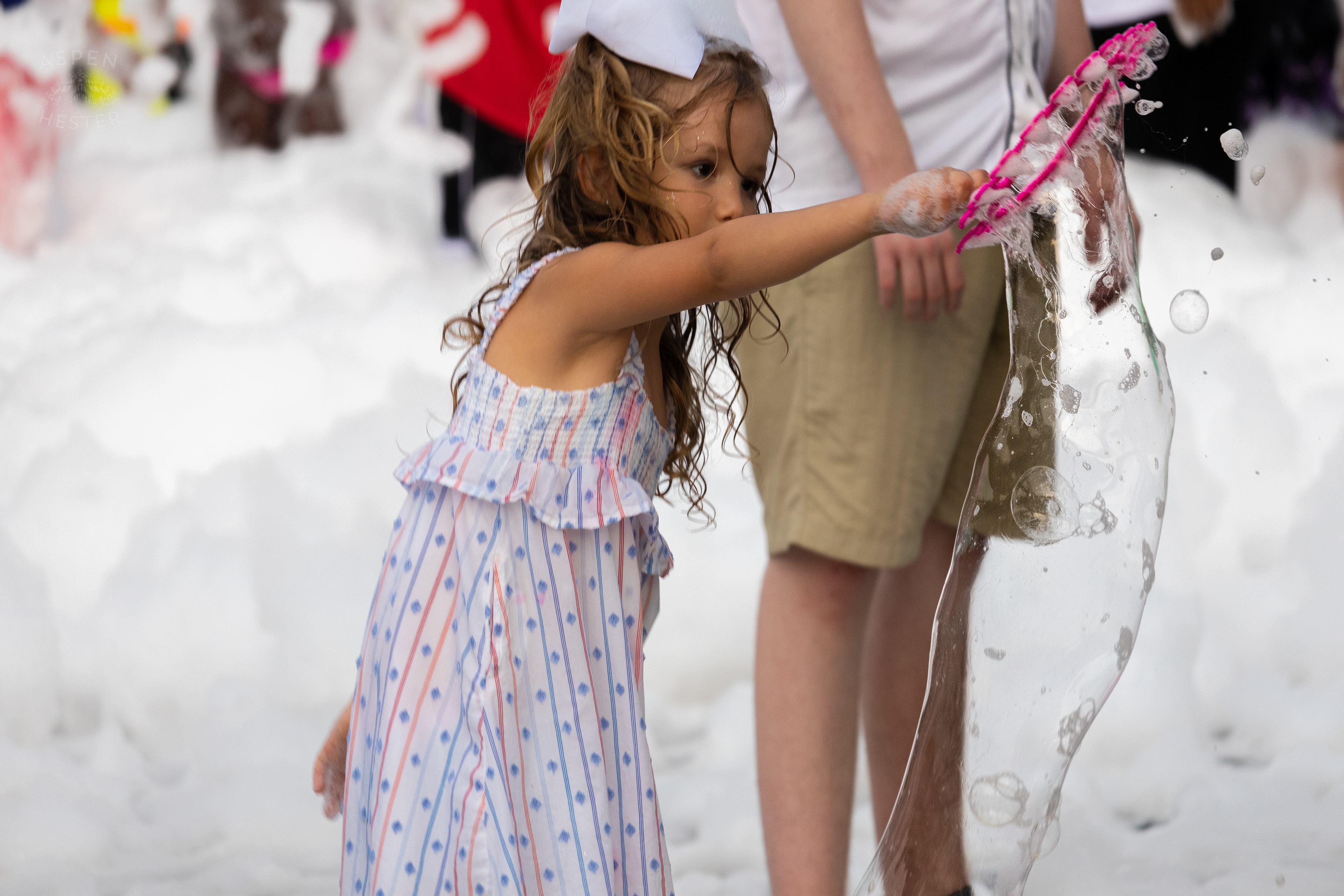 Christina Sanjuan's Daughter Playing in the Bubble Party at Waterfront Park Fourth of July. July 4th, 2024/Aspen Hester