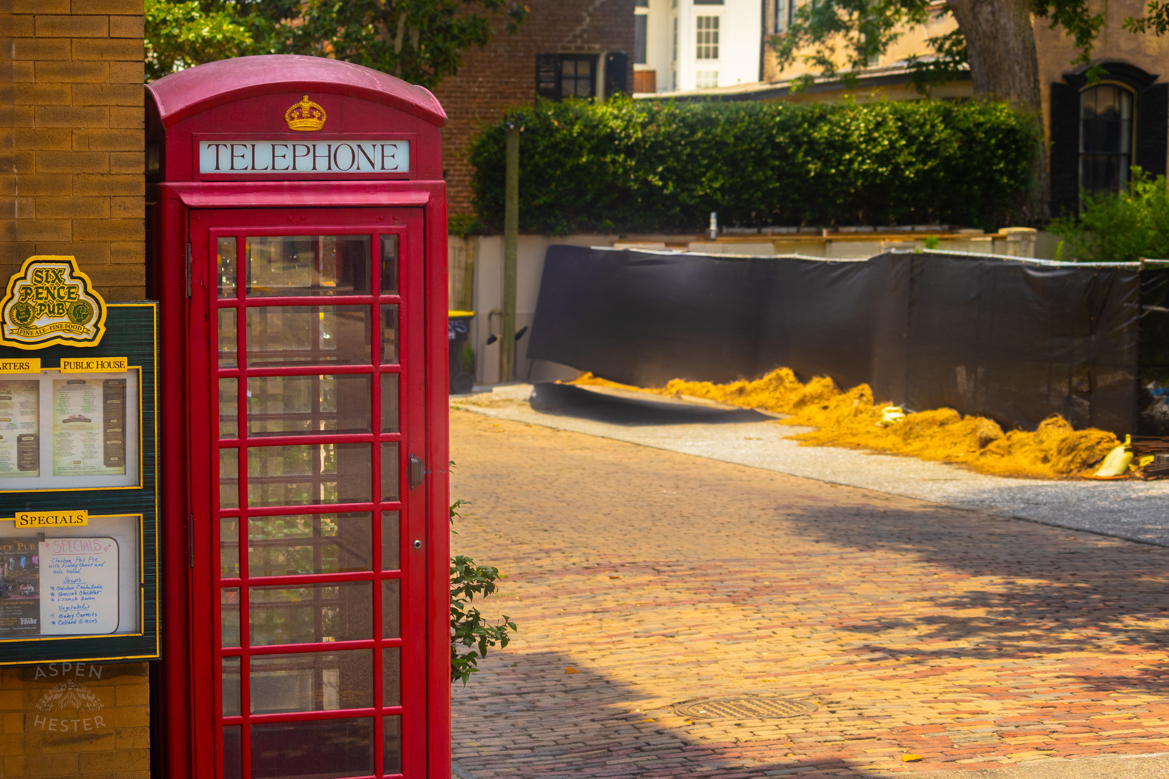 Red Telephone Box Outside The Six Pence Bar in Savannah Georgia. June 26th, 2024/Aspen Hester