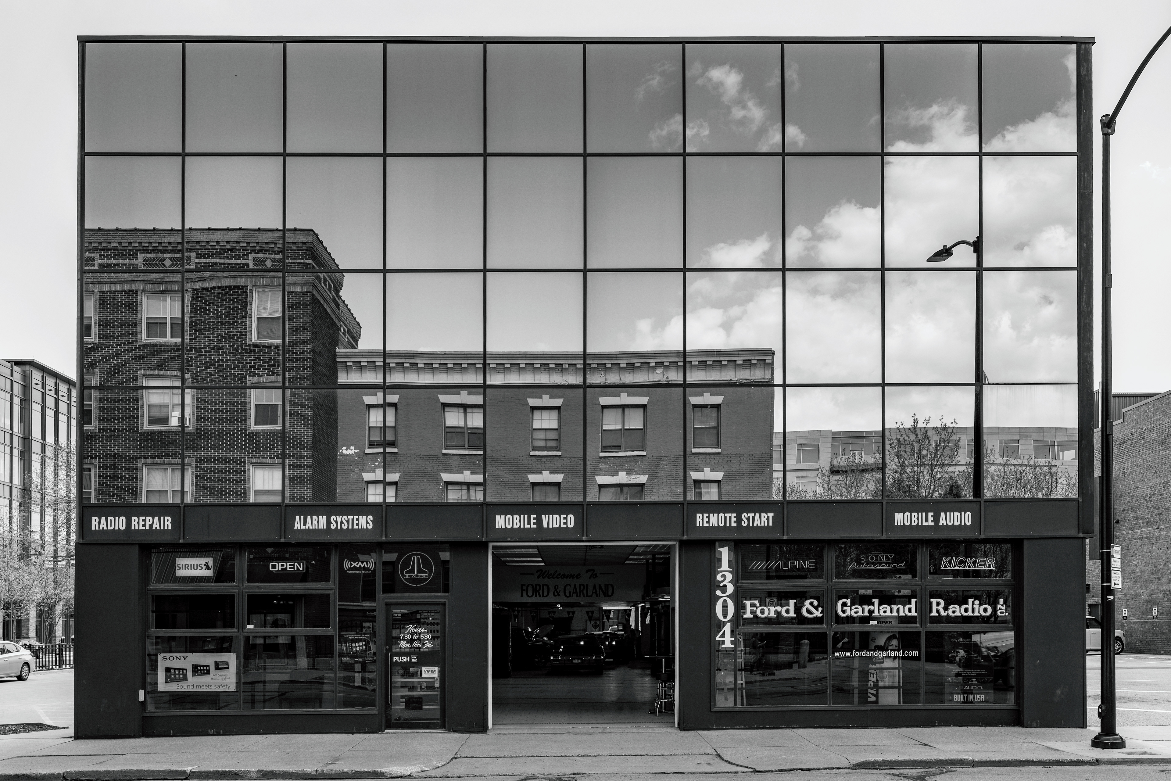 Black & White of Historic Building Reflected in Modern Building