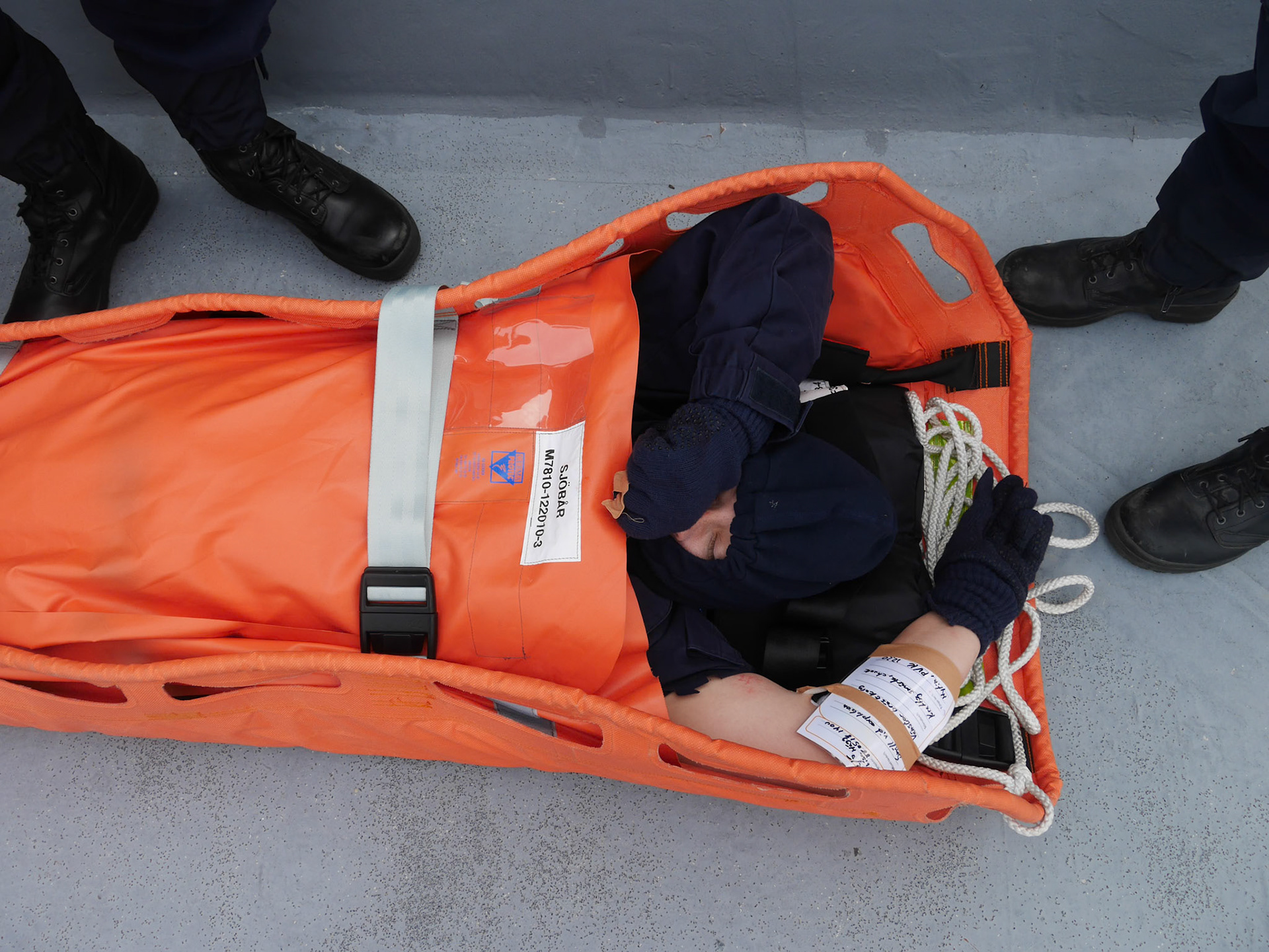 Wounded sailor awaiting medical evacuation