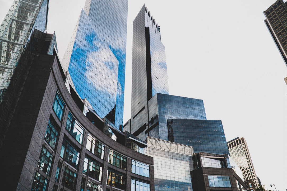 Buildings displaying curves and reflections near Central Park, New York.