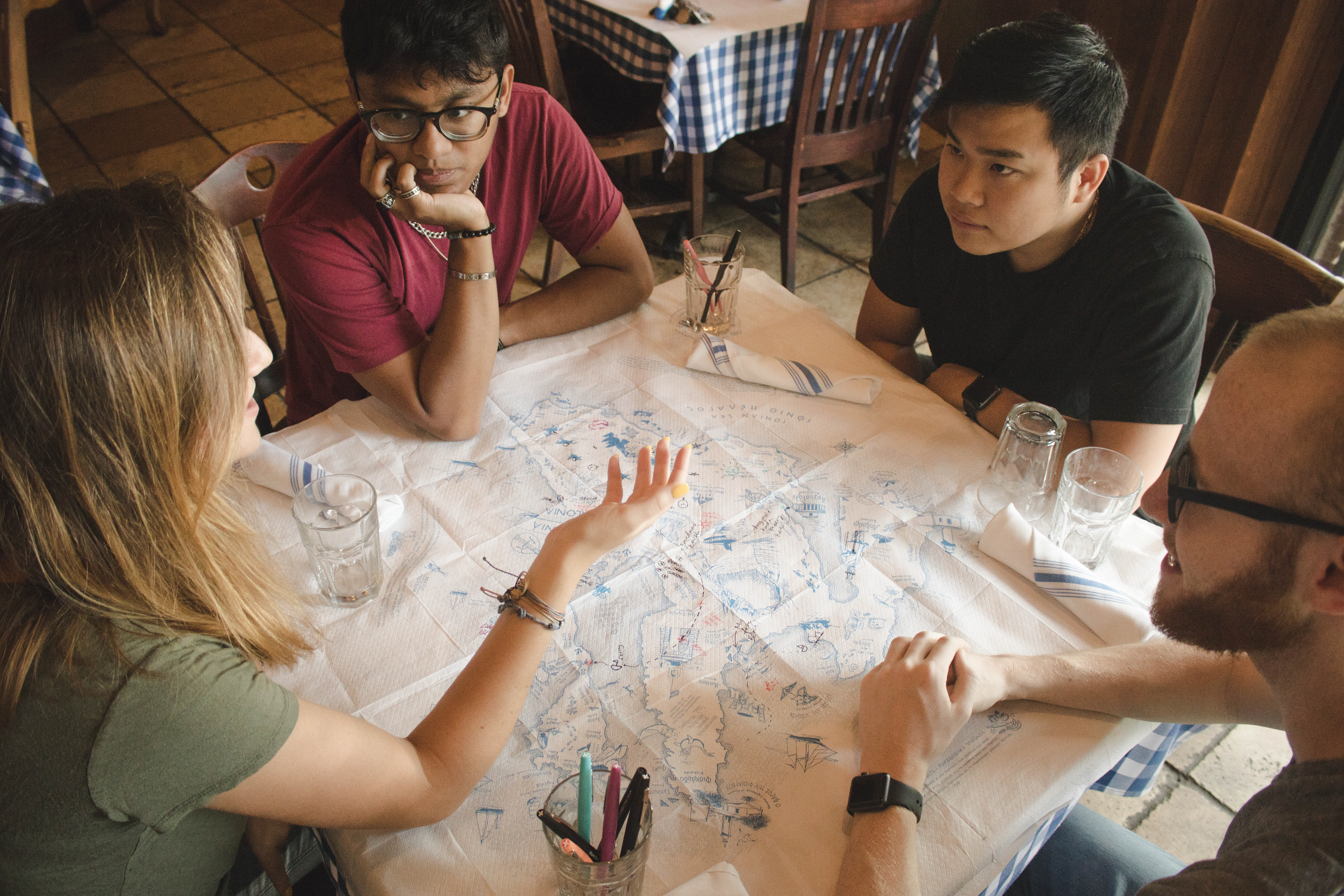 In the image above, we used a tablecloth from a restaurant in Greece to stage what the interaction would look like. Our actual designs are depicted in the presentation.