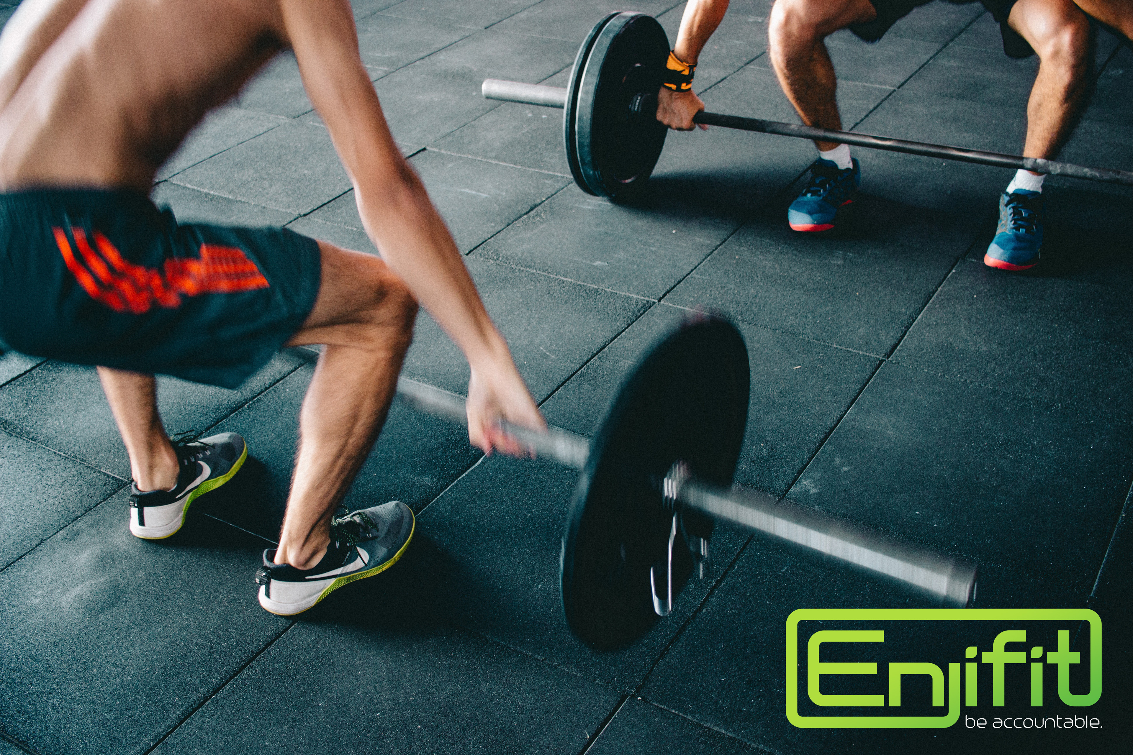 Gym logo brand with men lifting weights.