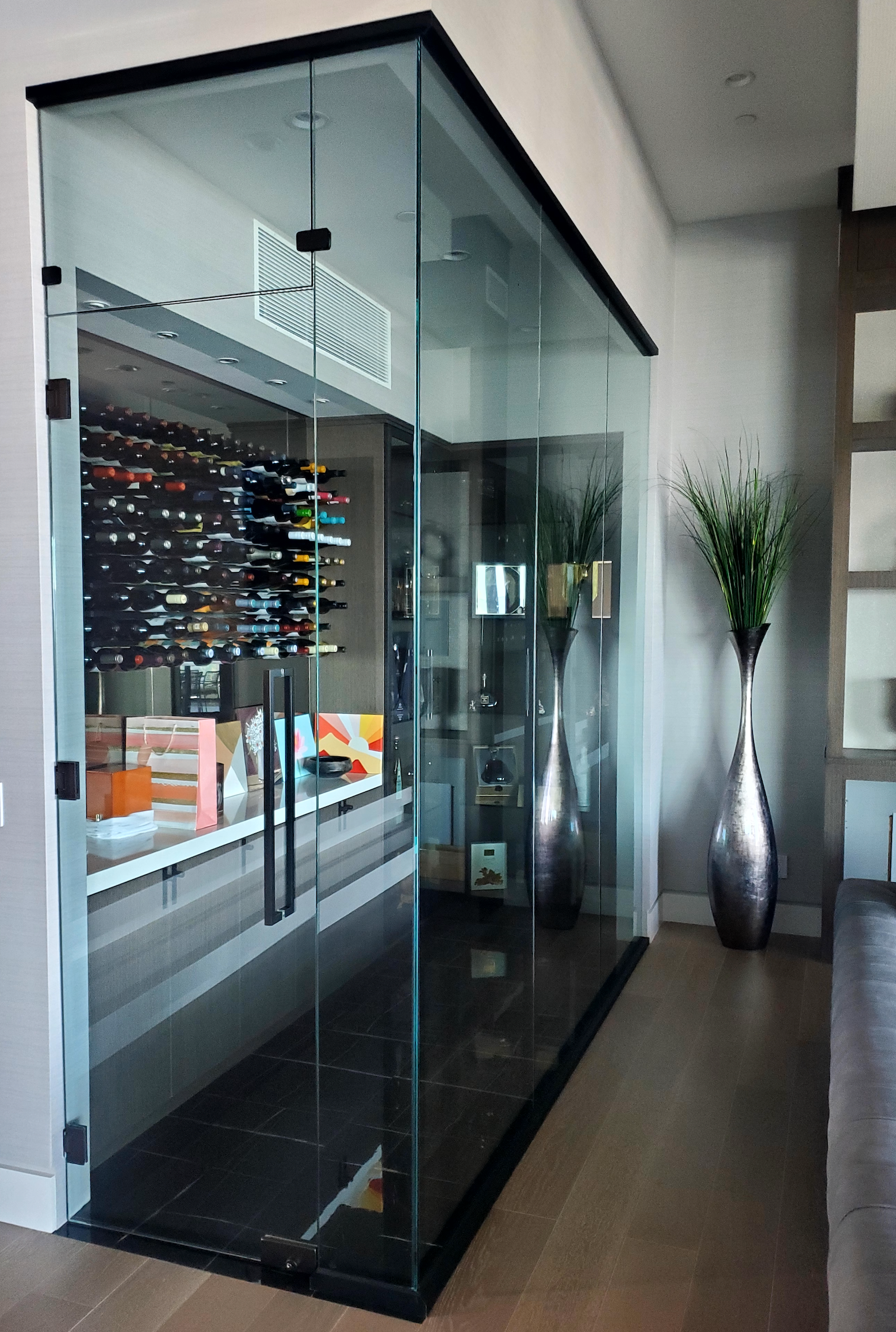 Custom Glass Wine Enclosure with Black Metal Framing