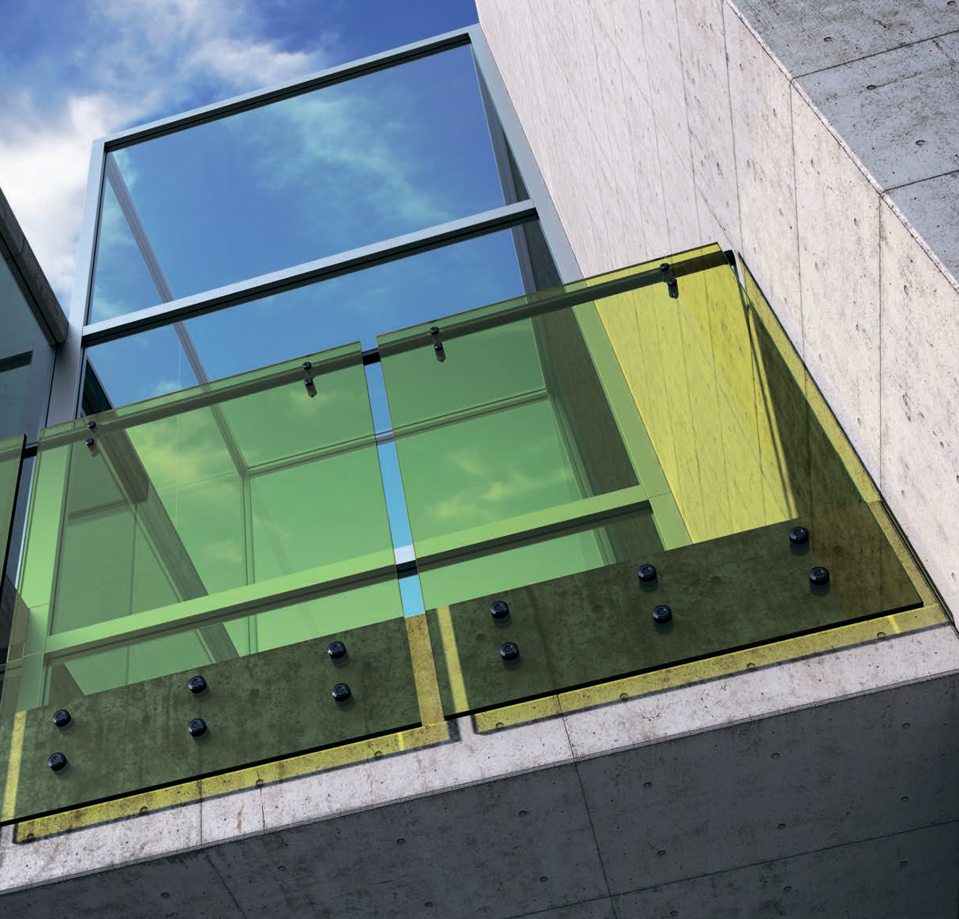 Green / yellow tinted glass balcony railing with metal standoff fittings