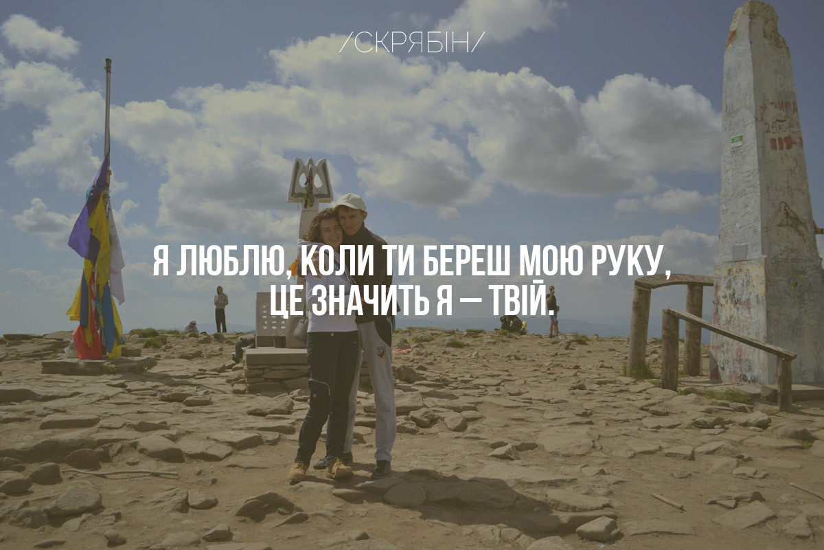 The state coat of arms of Ukraine, Tryzub, against background Dynamivska str barricades on fire. Euromaidan Protests. Events of Jan 19, 2014.