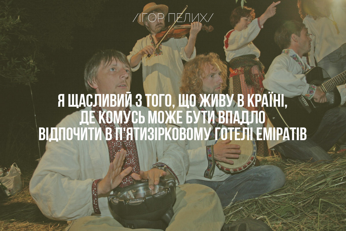 The state coat of arms of Ukraine, Tryzub, against background Dynamivska str barricades on fire. Euromaidan Protests. Events of Jan 19, 2014.