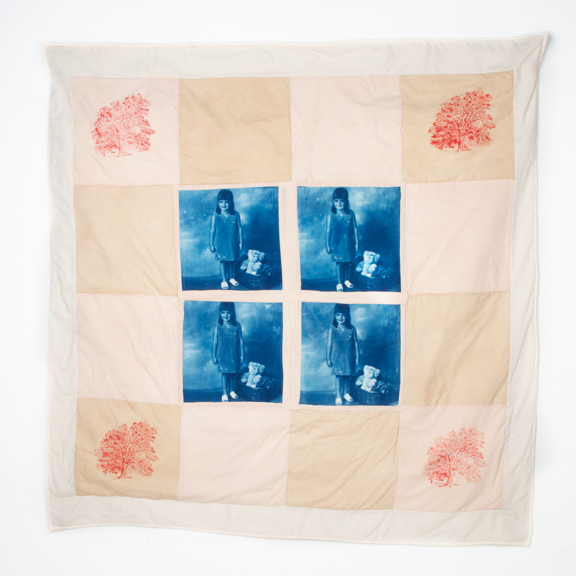 Cotton cyanotype print, machine quilted, cotton fabrics dyed with tea and coffee, cotton batting, and laser-etched stamp. 53" x 55"