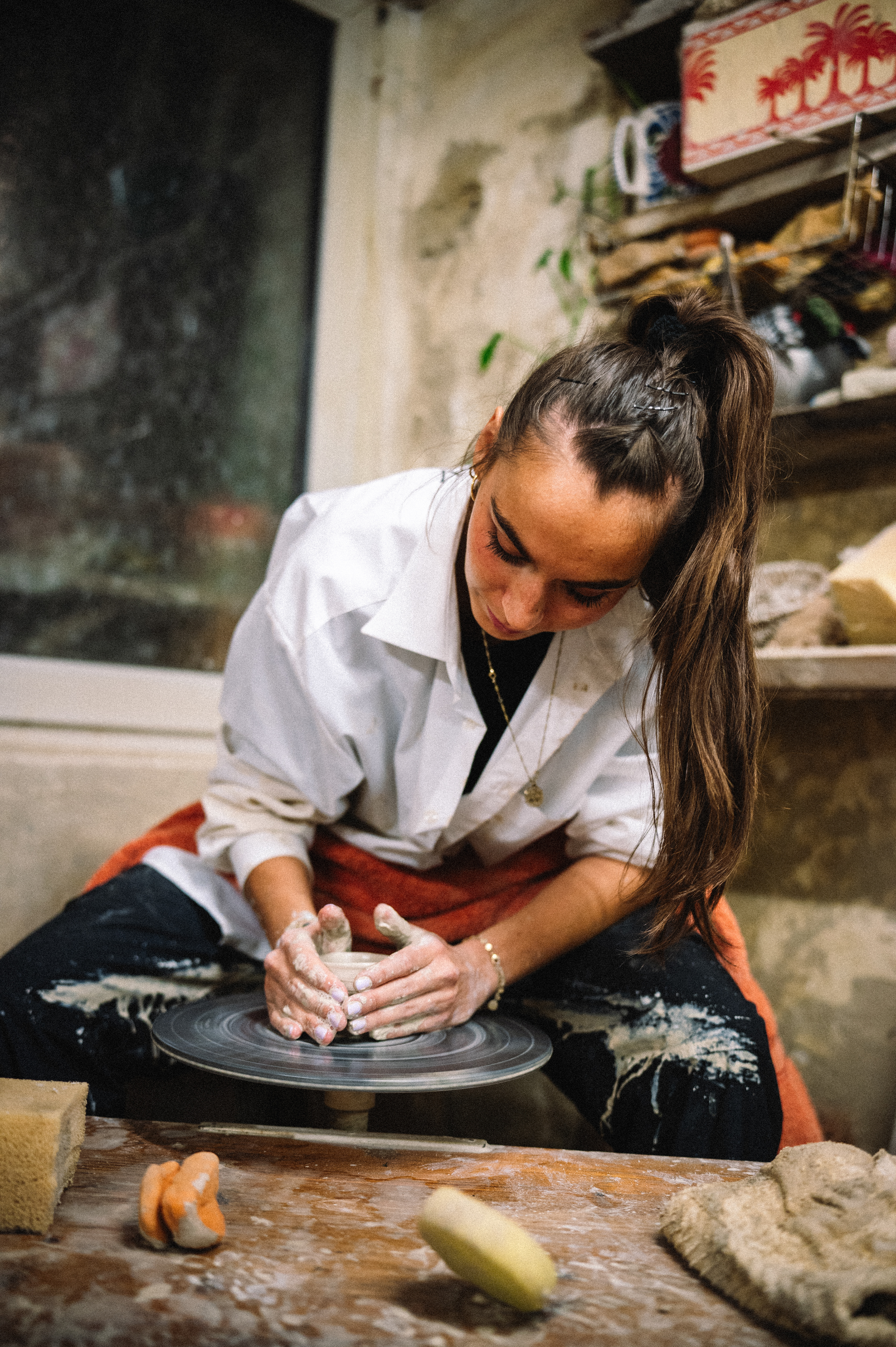 Rosely Campbell doing ceramics at the wheel