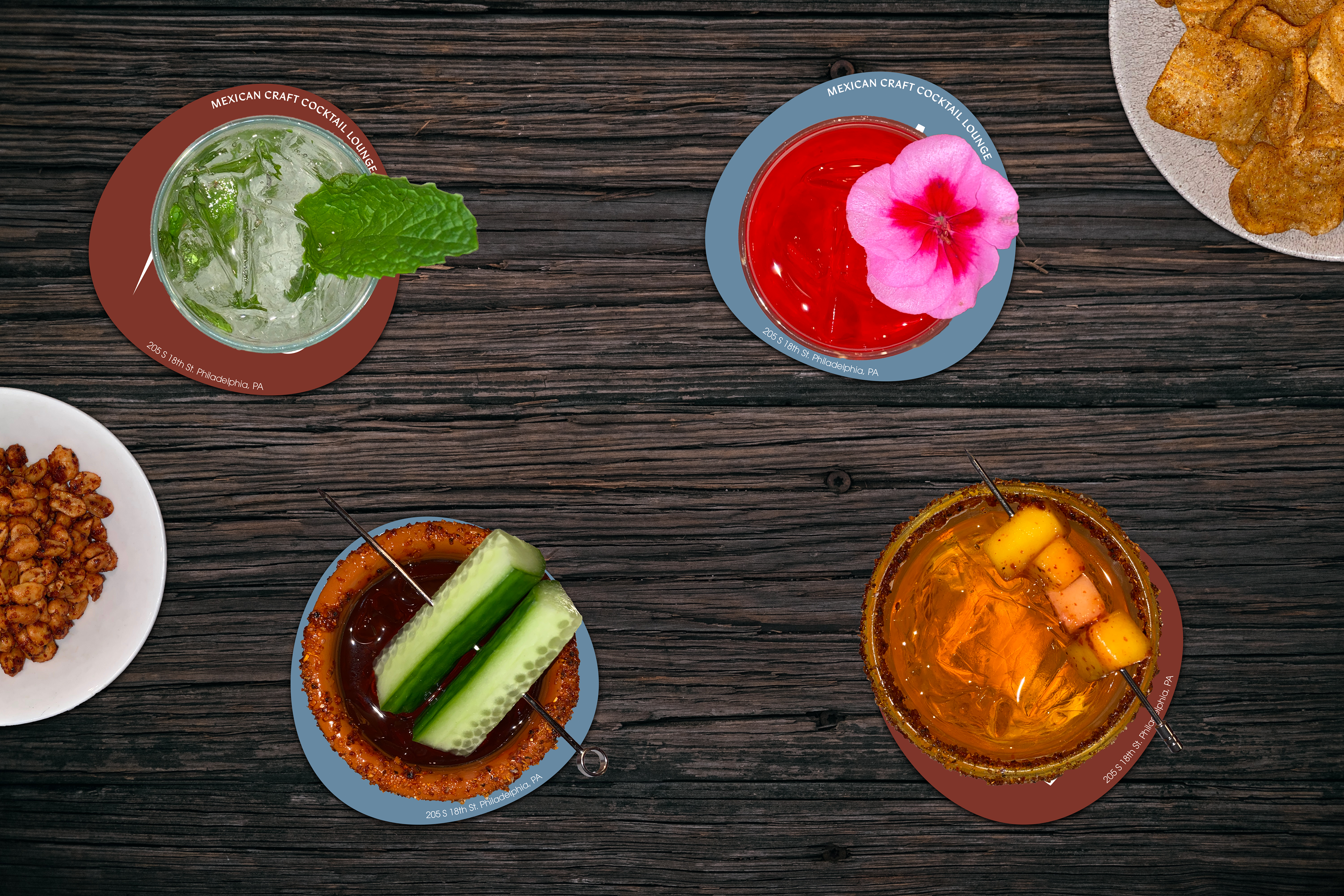 Aerial view of Más craft cocktails on coasters