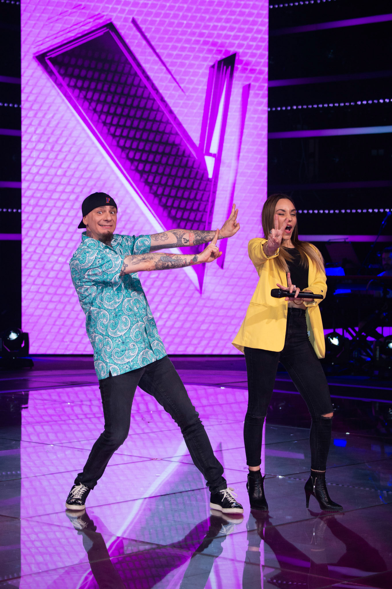 J-Ax and Beatrice Pezzini attends 'The Voice Of Italy' final photocall on May 8, 2018 in Milan, Italy