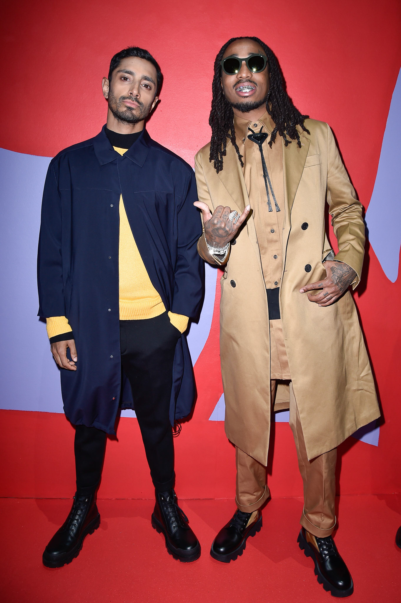 Riz Ahmed (L) and Quavo (R) attend the Prada Show during Milan Menswear Fashion Week Fall/Winter 2020/21 on January 12, 2020 in Milan, Italy
