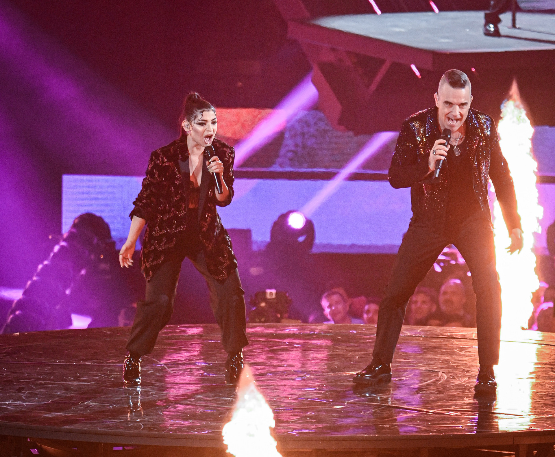 Robbie Williams and Federica Buda performs on stage during X Factor 2019 Final at Mediolanum Forum of Assago on December 12, 2019 in Milan, Italy