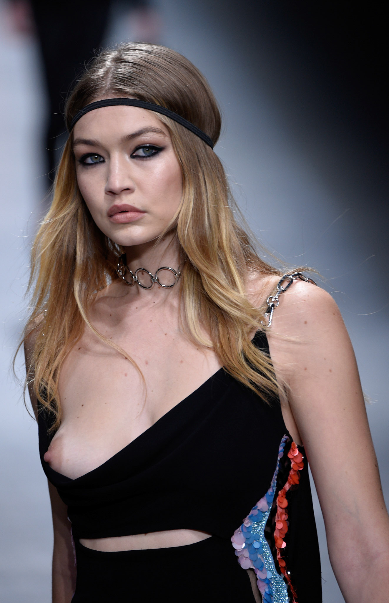 Gigi Hadid walks the runway at the Versace show during Milan Fashion Week Fall/Winter 2016/17