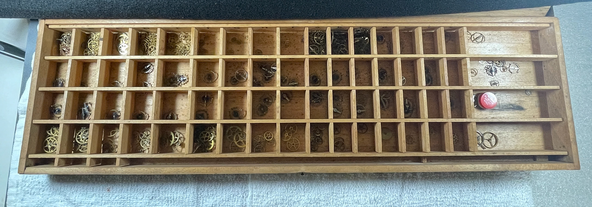 Assorted watch wheels & balances in wooden case