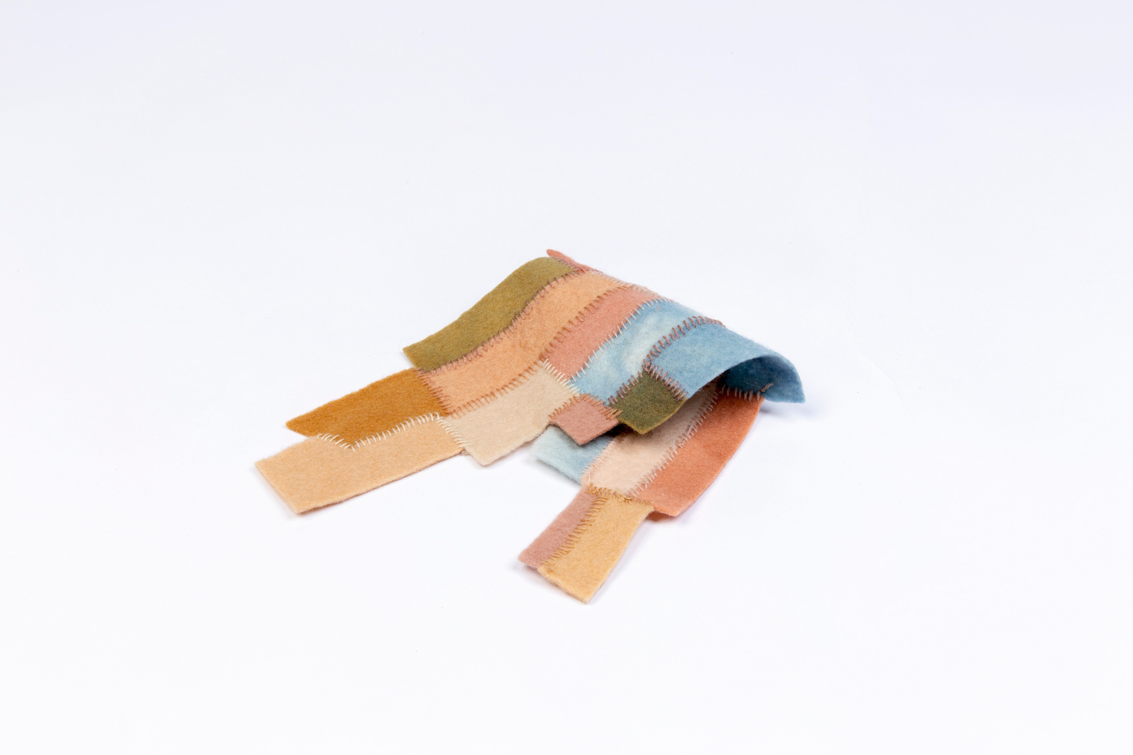 Plant dyed & hand stitched wool piecing