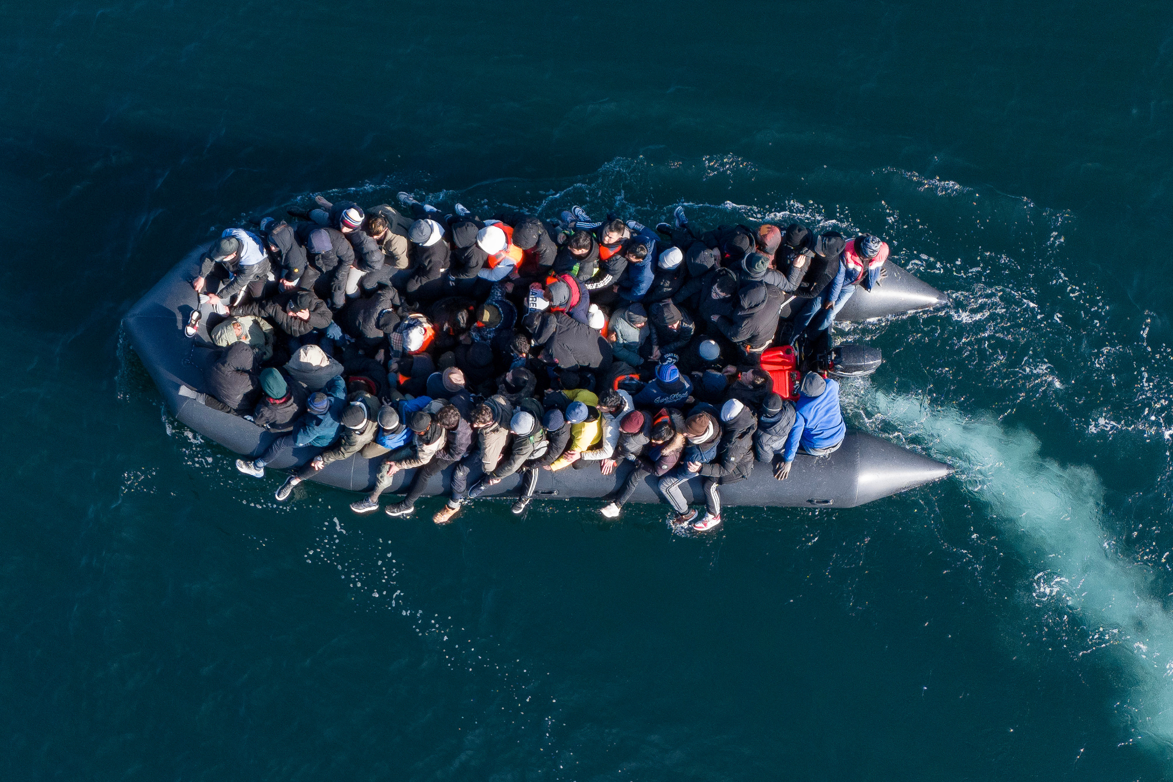Migrants cross the English Channel on a small boat