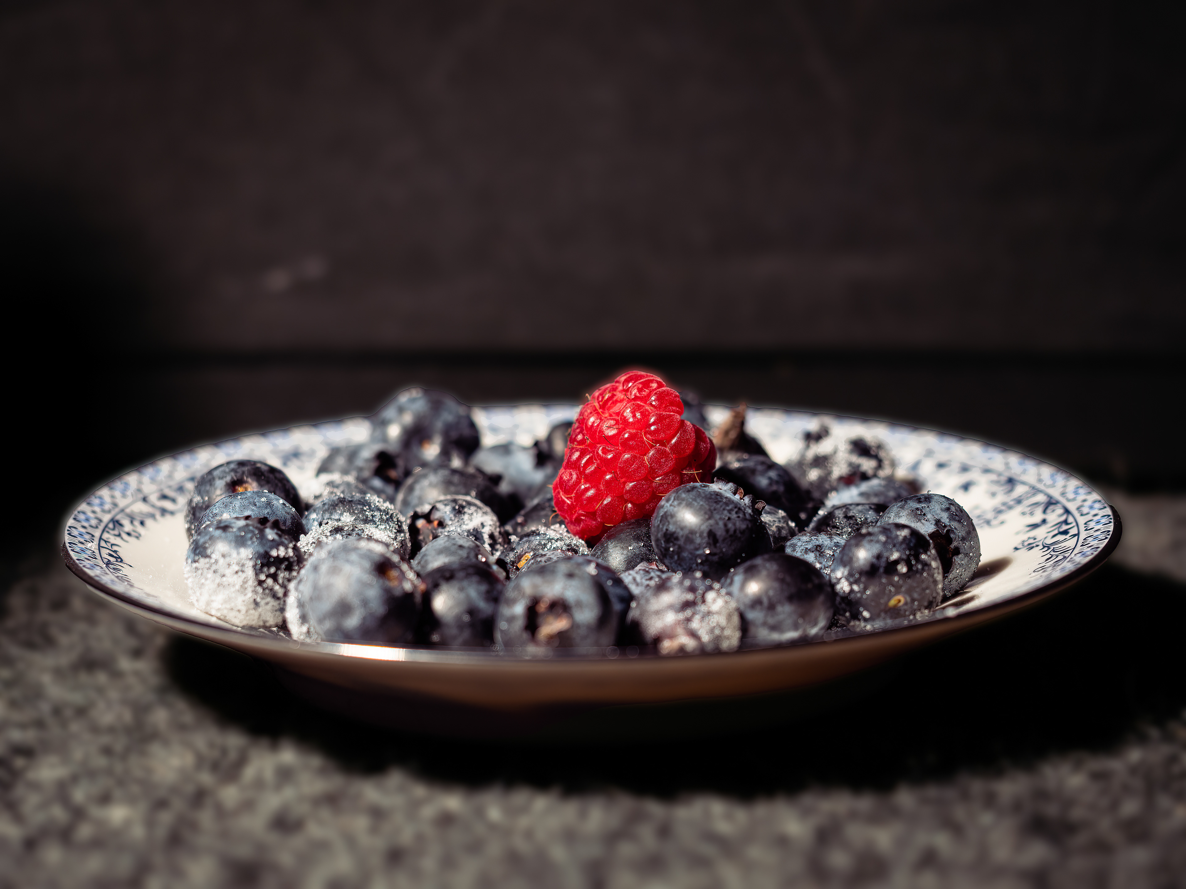 Blueberries and a Raspberry