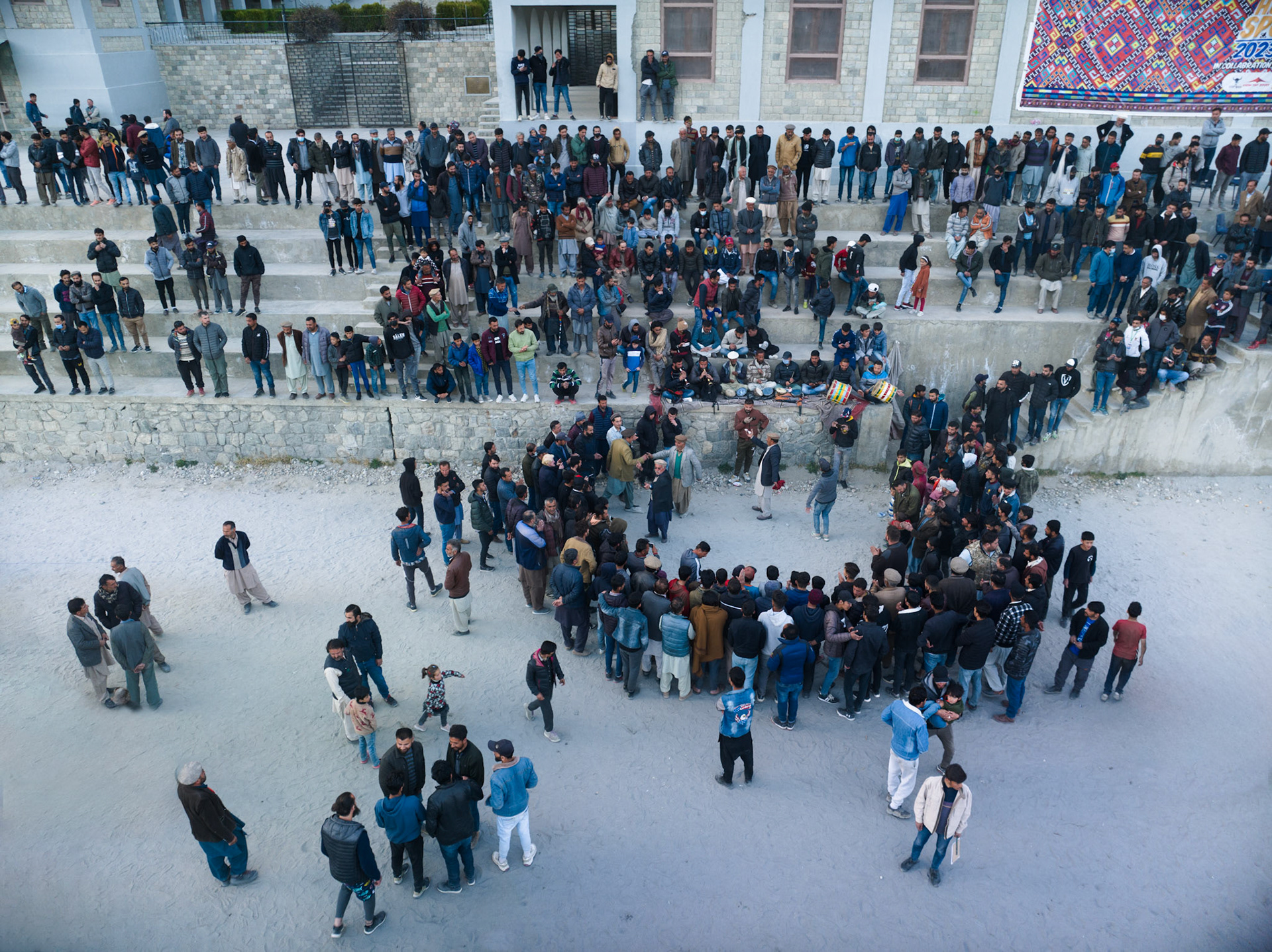 Aerial View of celebration after winnin tug of war championship, Hunza Valley, Himalayas, GIlgit Baltistan Pakistan