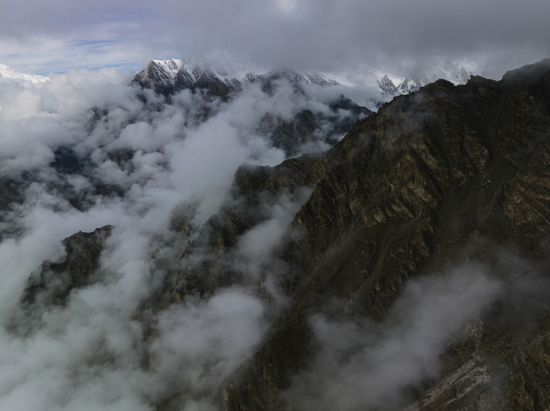 Aerial View of mountains  from above cloud layer, Himalayas, Hunza Valley, Pakistan