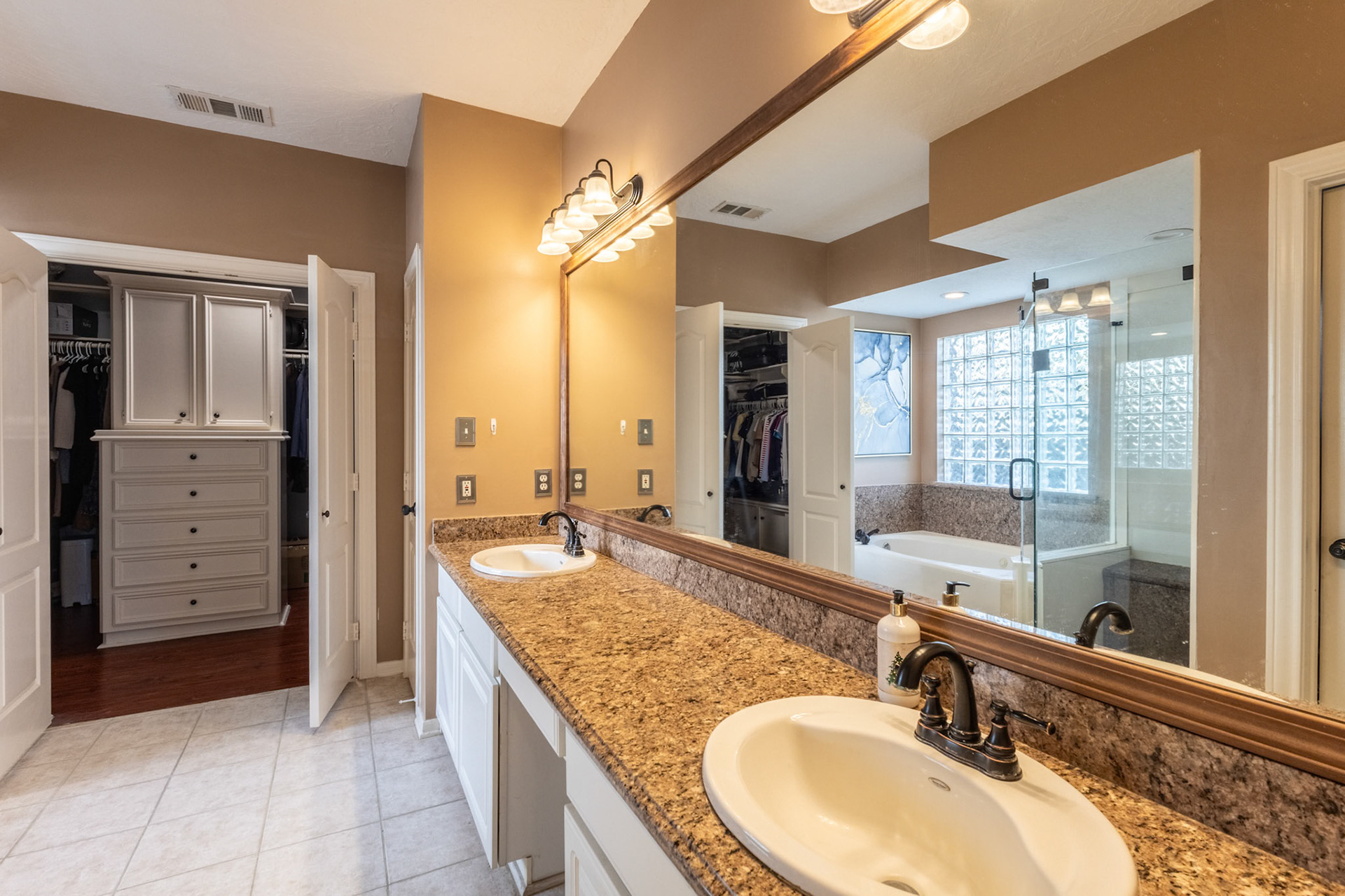 Bathroom with a grand closet