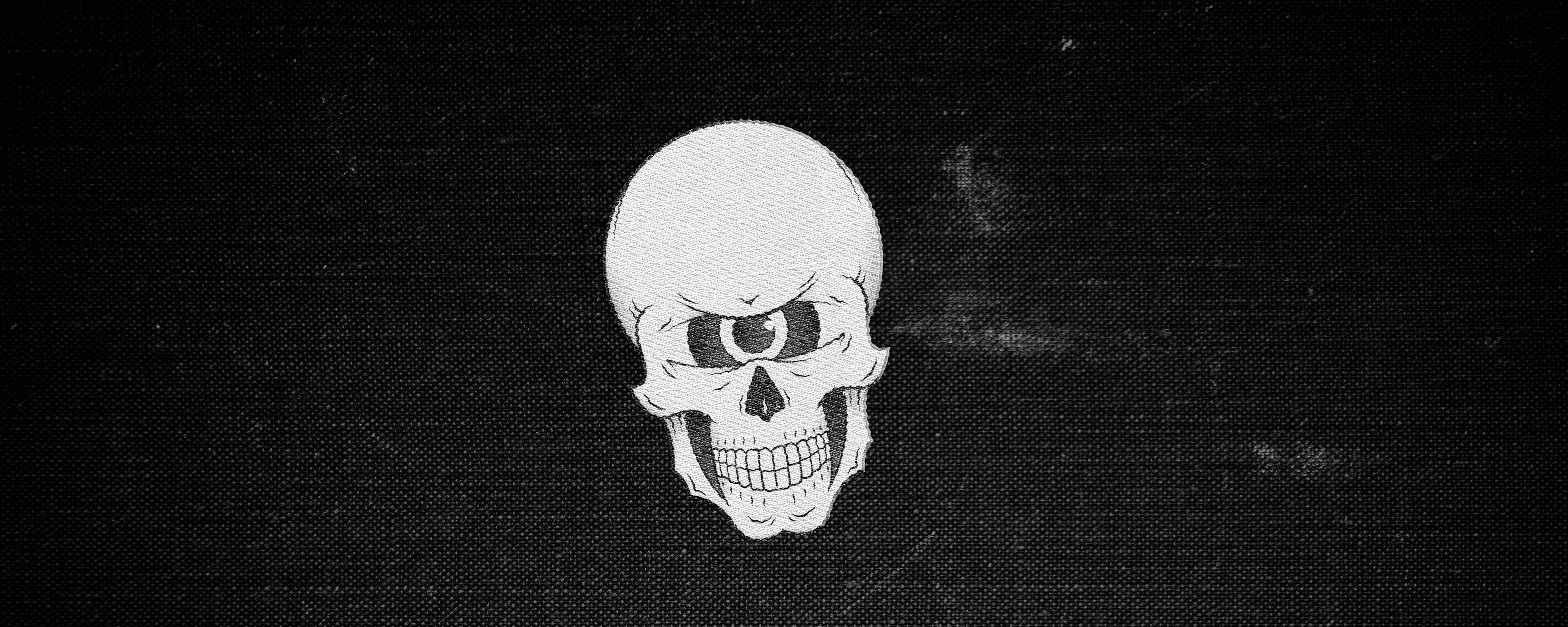 A black and white illustration of a skull with one eye on a textured background.