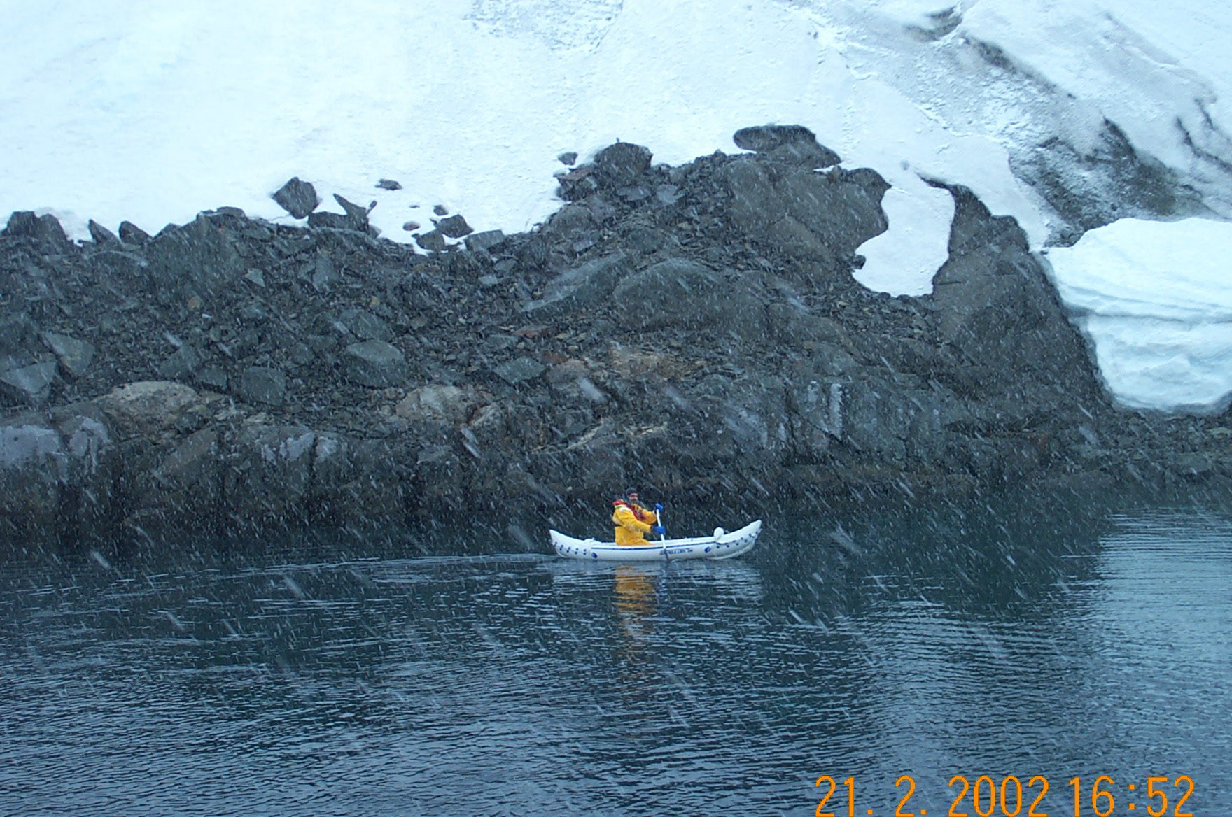 Captain Andy paddles in the snow in his rubber canoe