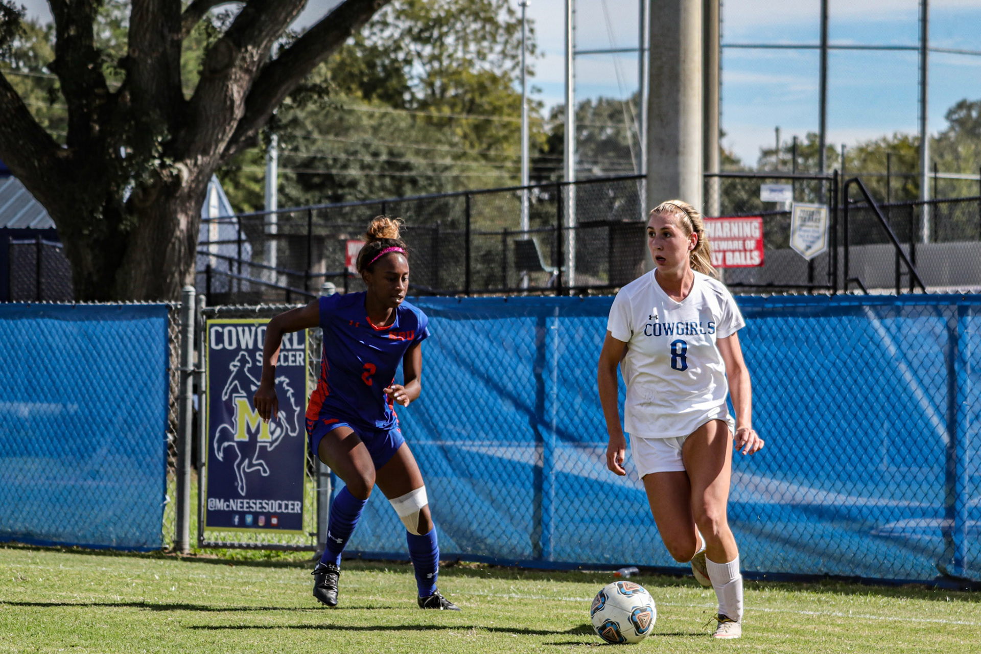 Anna Watson (8) of McNeese State University looks to cross the ball into the box against Houston Baptist University.
