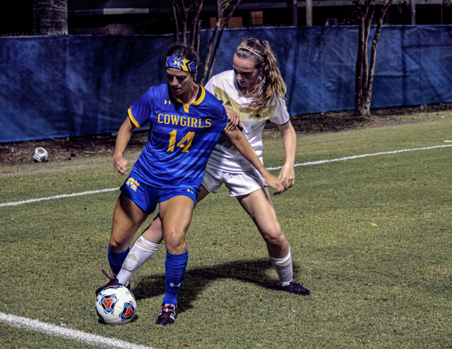Morgan Middleton (14) of McNeese State University remains focused controlling the ball against Texas State University.
