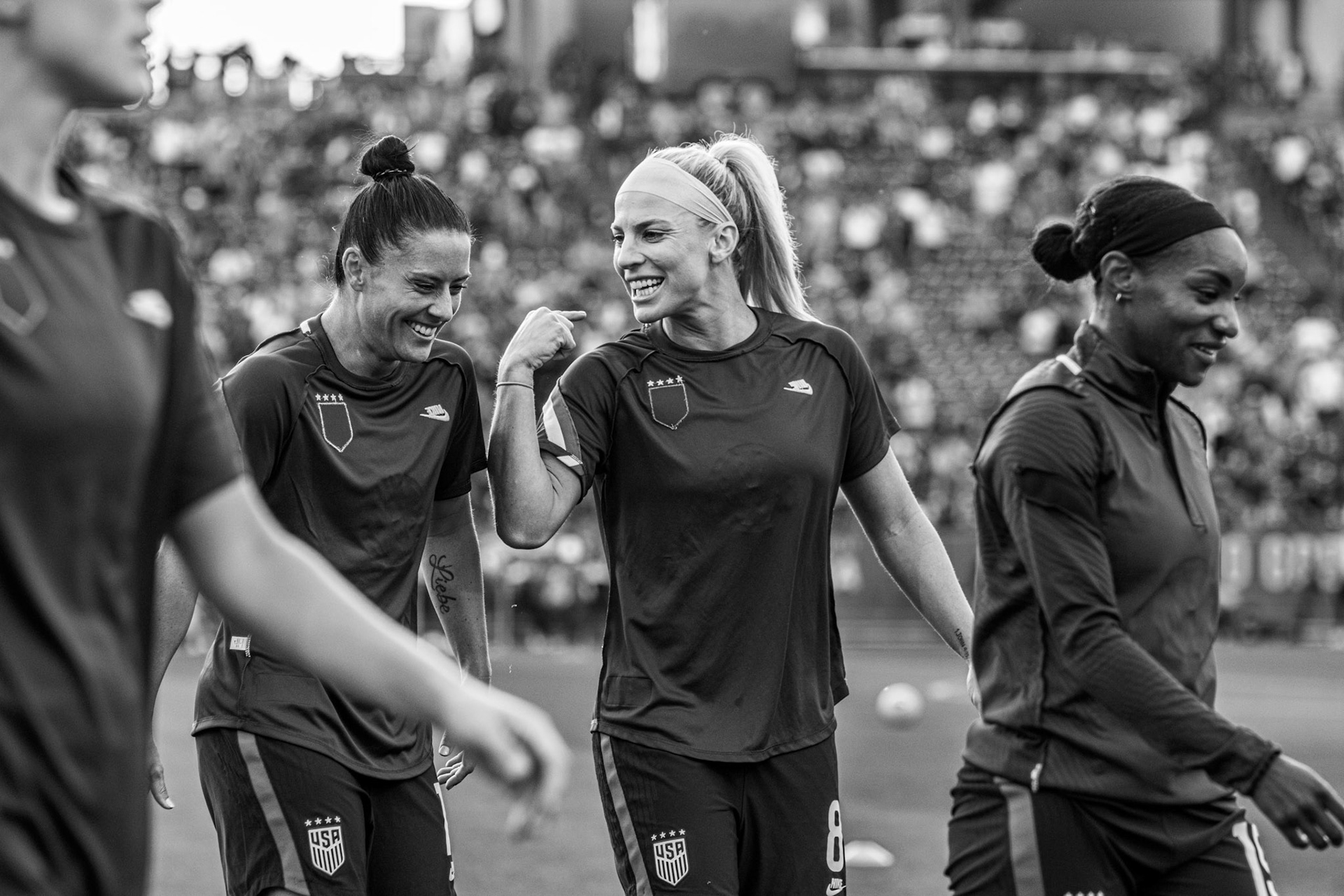 Ali Krieger and Julie Ertz share a laugh during warmups.