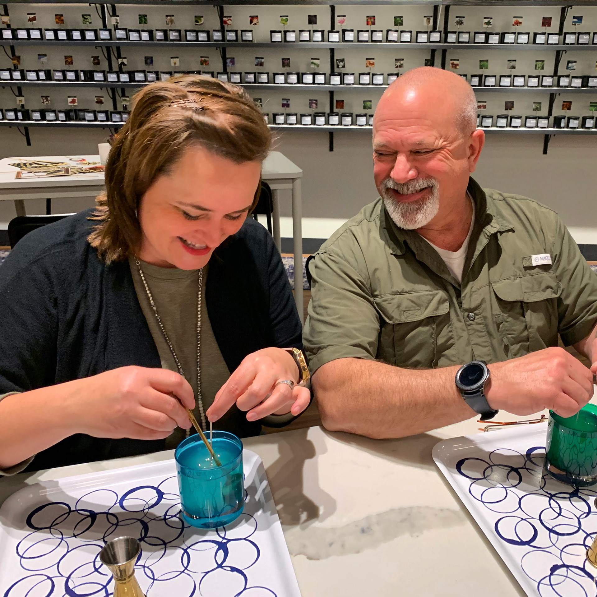 Two guests blending custom fragrances at Foxfire Candle Works