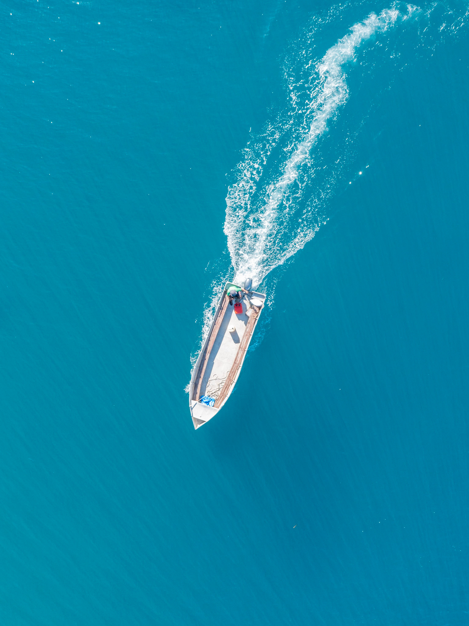 aerial close up view of a fishing boat near castaway island fiji