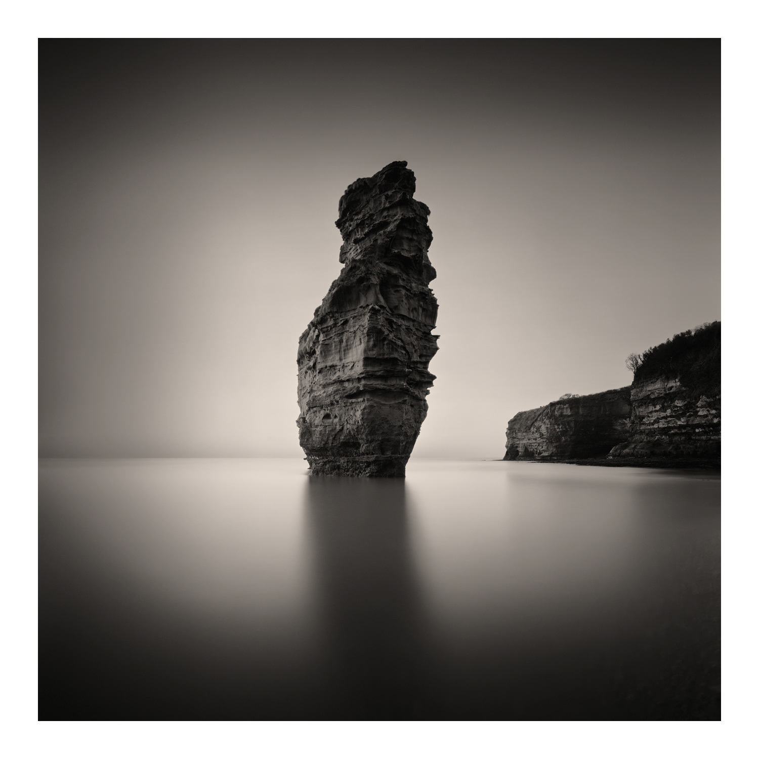Fine Art Photograph by Colin Ironside Homes entitled "Tall Rock in Bay"