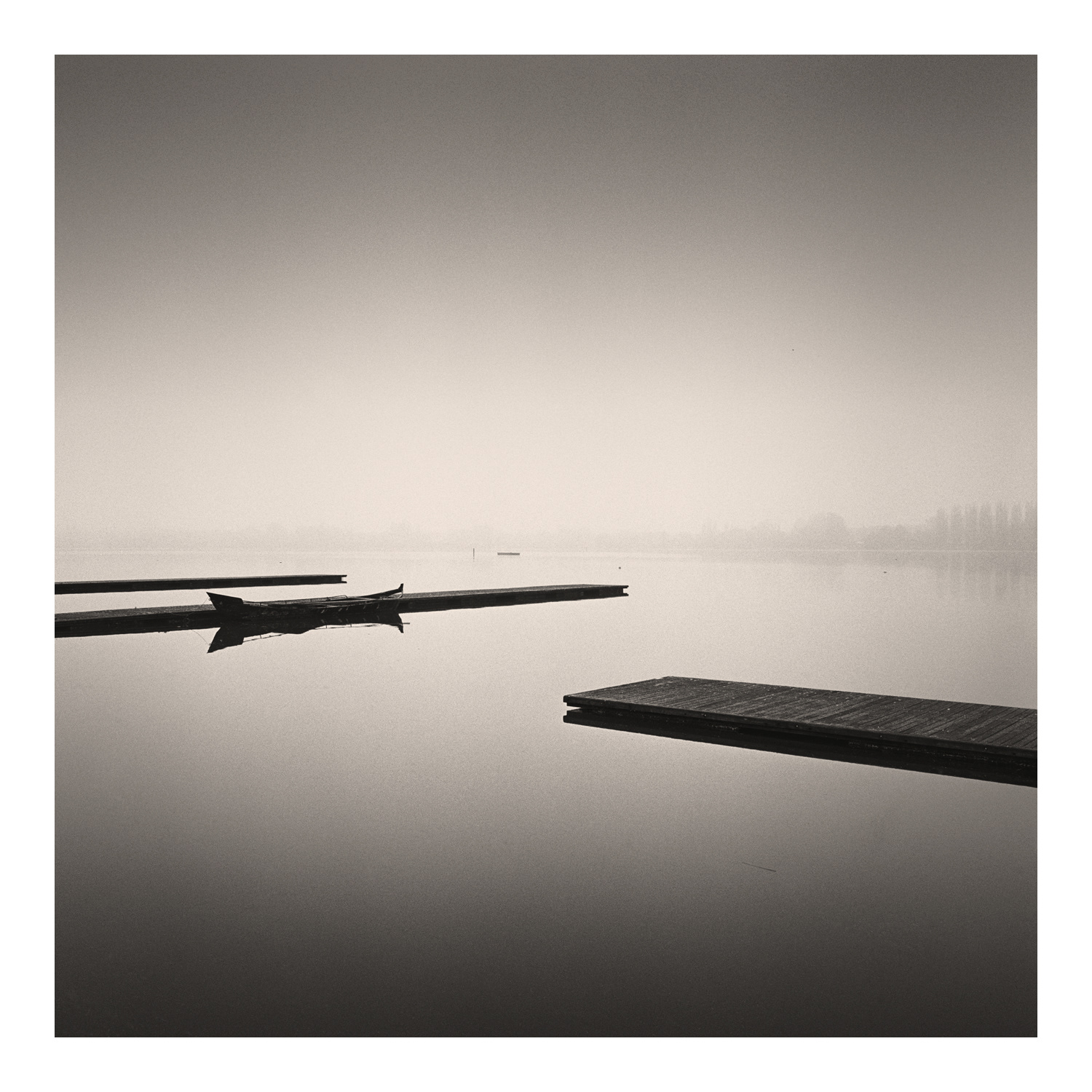 Black and white photograph of three jetties in Mantova Italy by Scotting Photographer Colin Ironside Homes