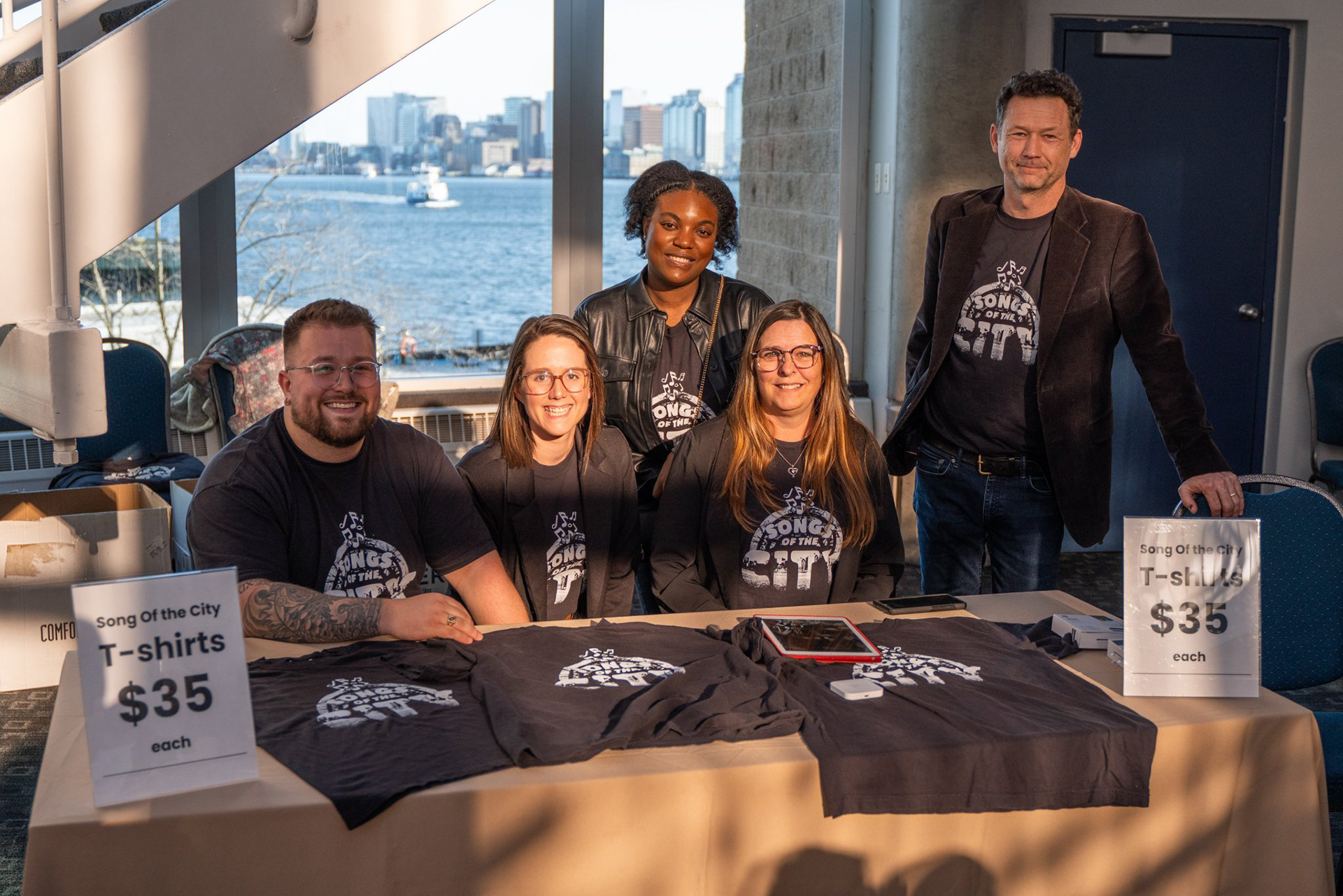United Way Halifax staff selling t-shirts